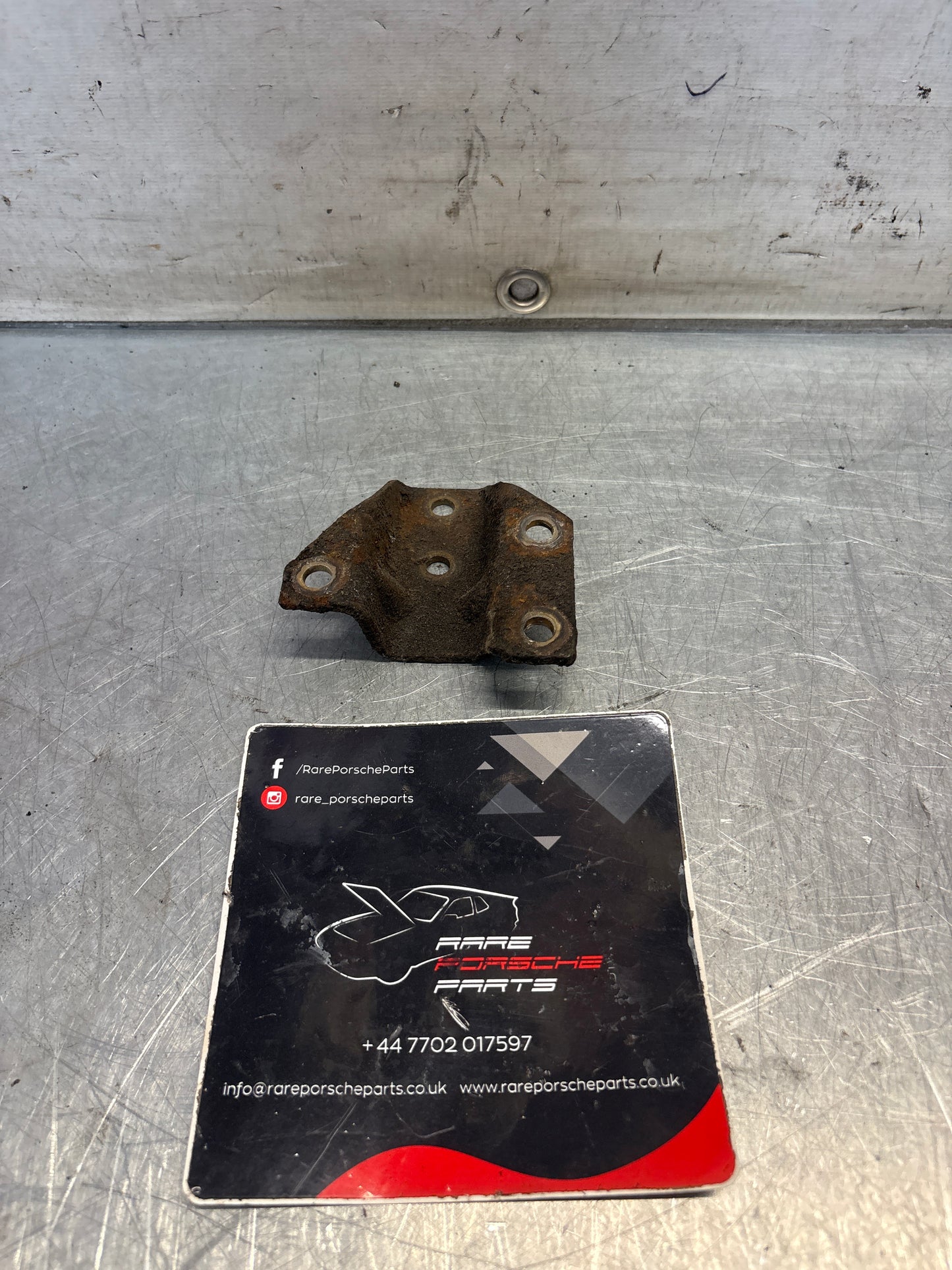 Porsche 924 944 hook trestle bracket, left, used 477399167E