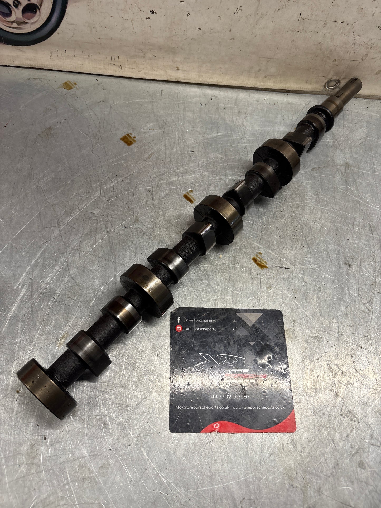 Porsche 928 cam shaft, used 9281052040R