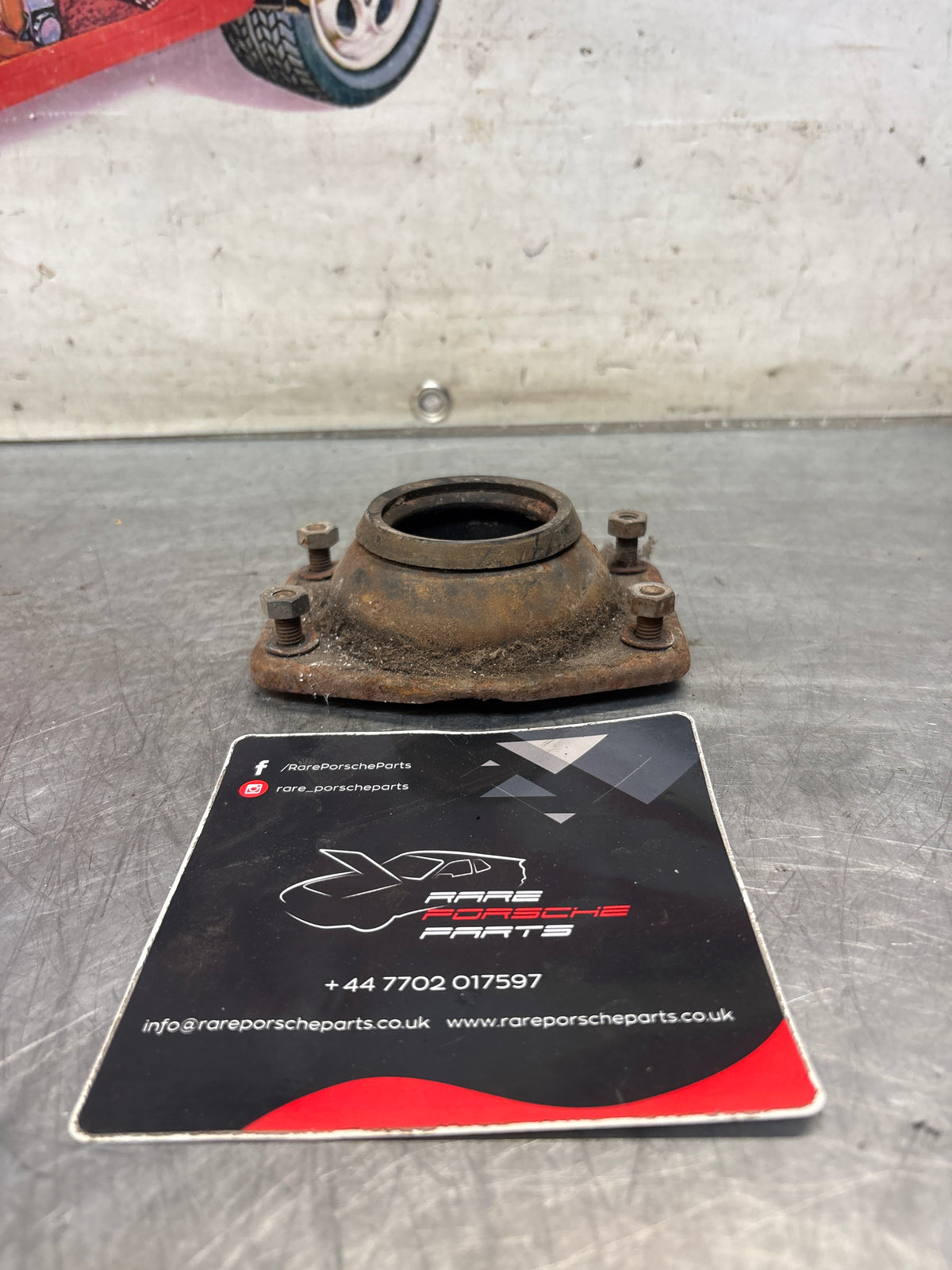 Porsche 924 / 944 front suspension bearing flange, 477412345, used
