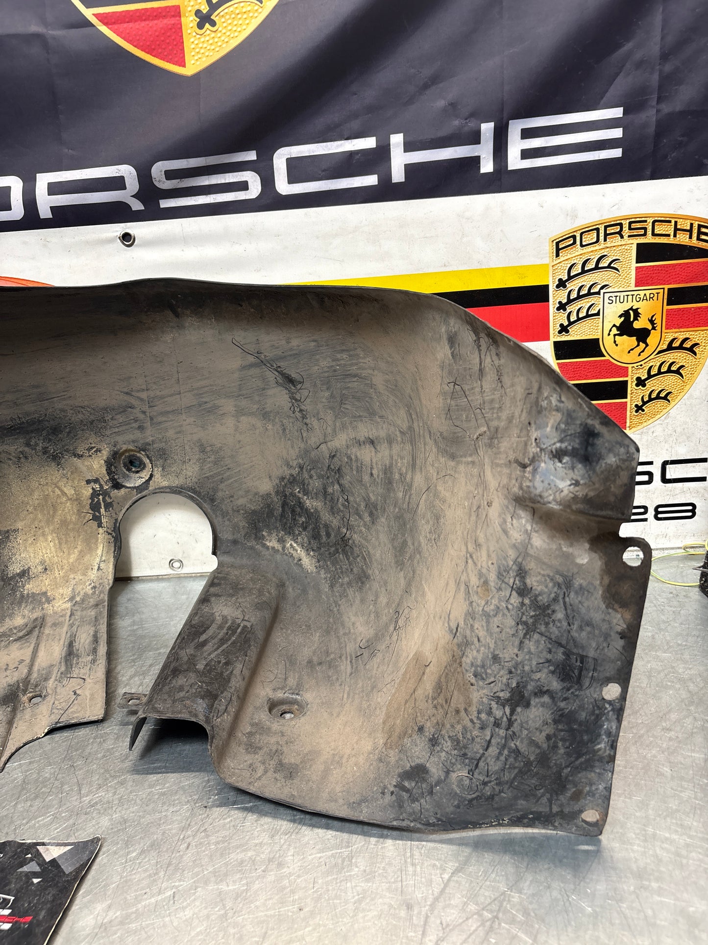 Porsche 944 from 85.5 wheel arch liner  Left, 94450438101 Used