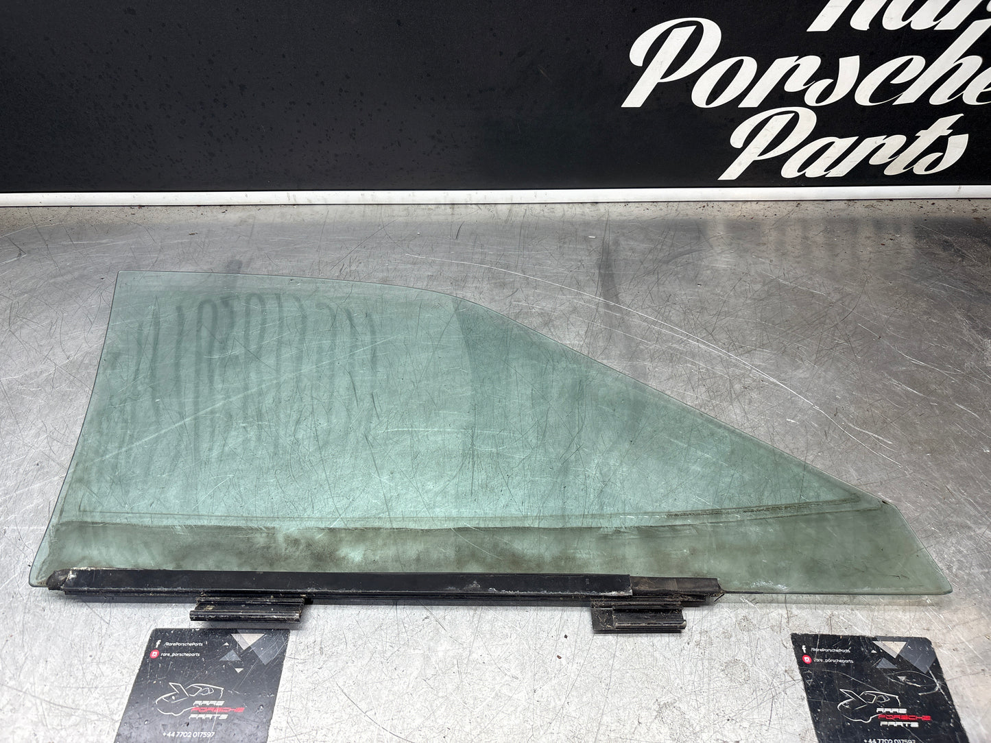 Porsche 944 Left side door glass, tinted green used 94454202301