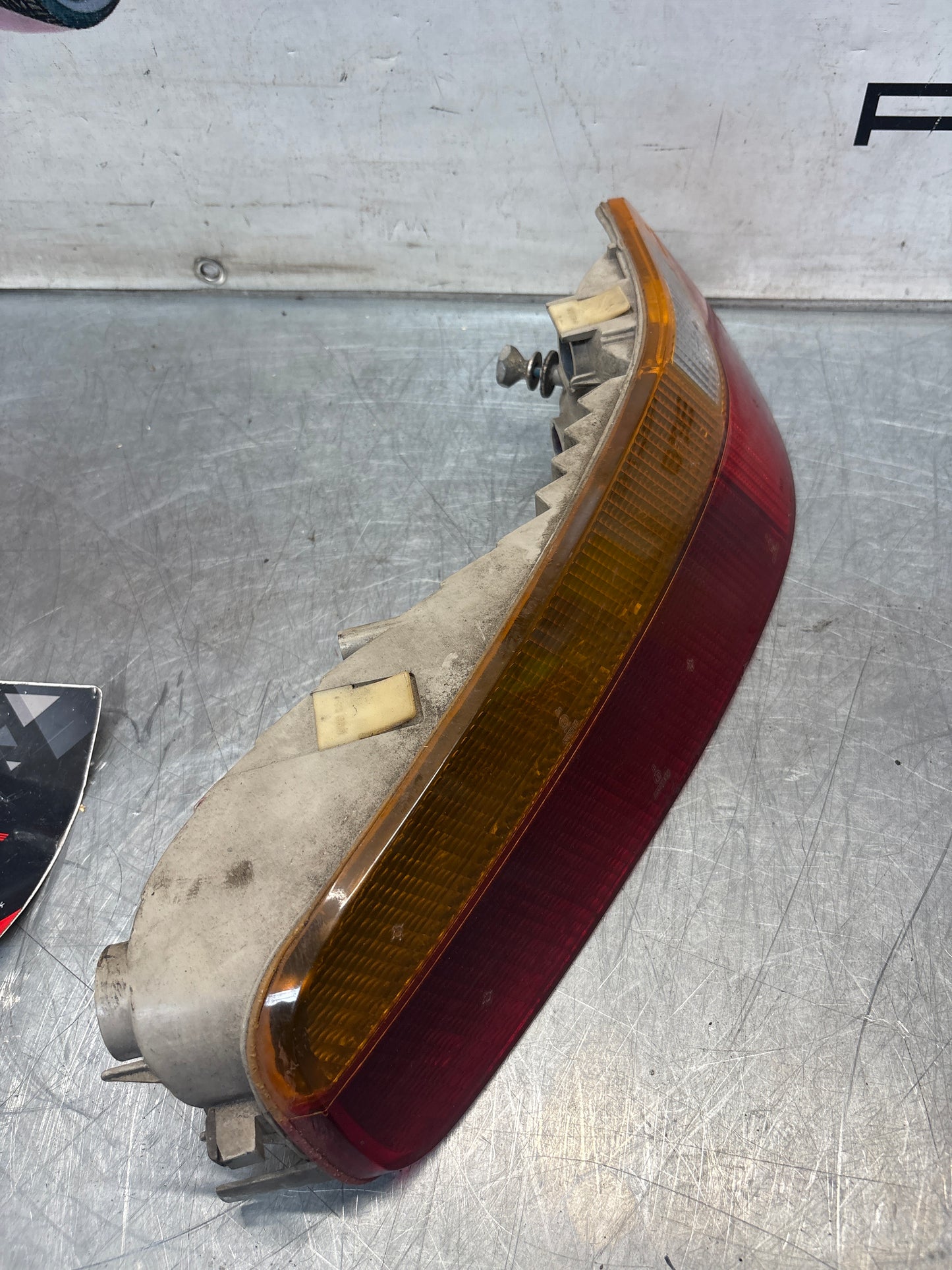 Porsche 928 rear left tail light, used, 92863104300