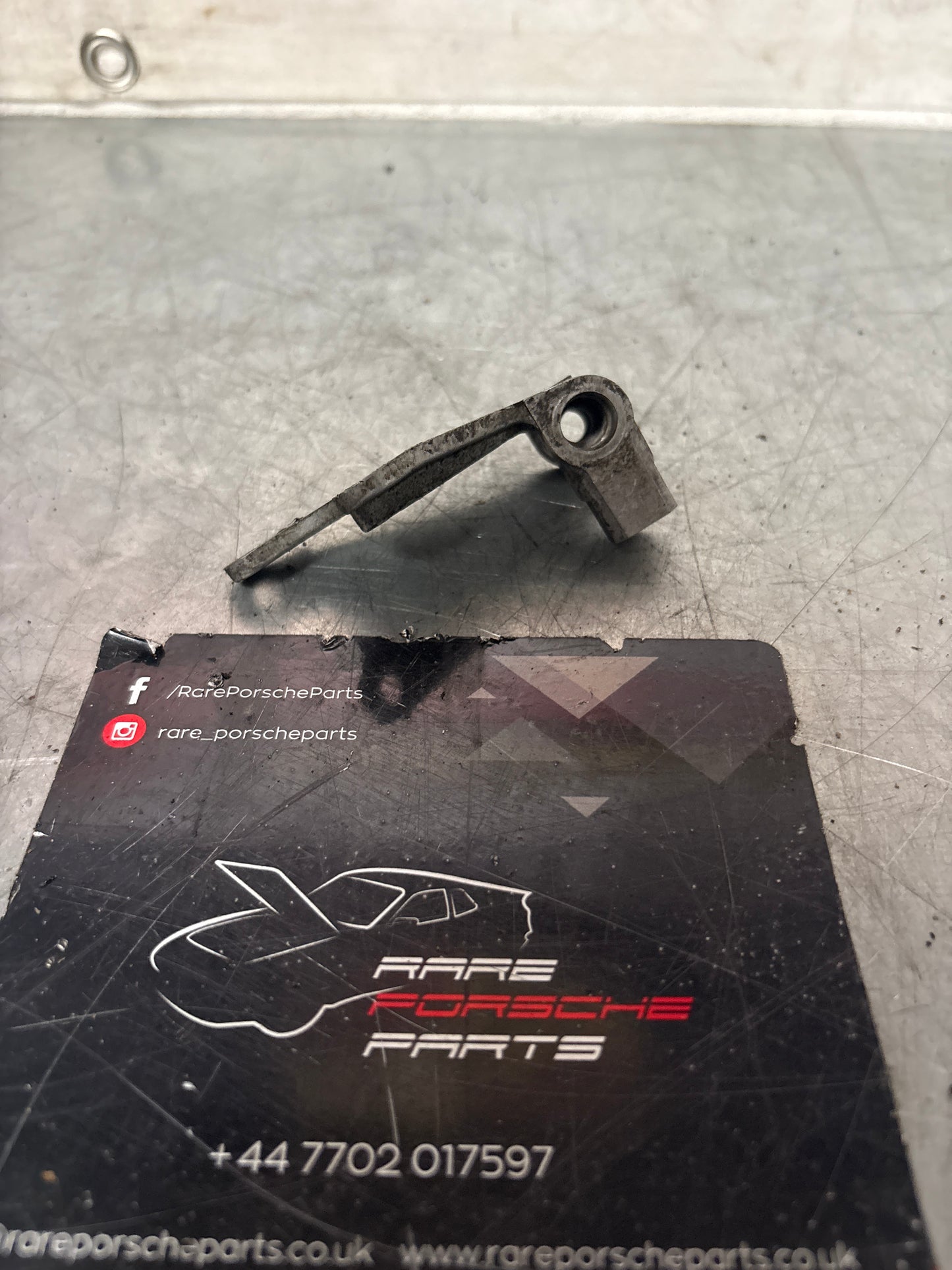 Porsche 924 Solenoid valve support bracket (used) 477133529C