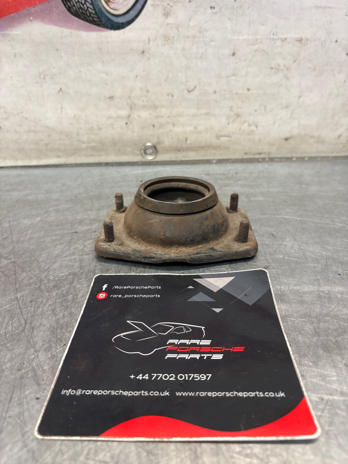 Porsche 924 / 944 front suspension bearing flange, 477412345, used