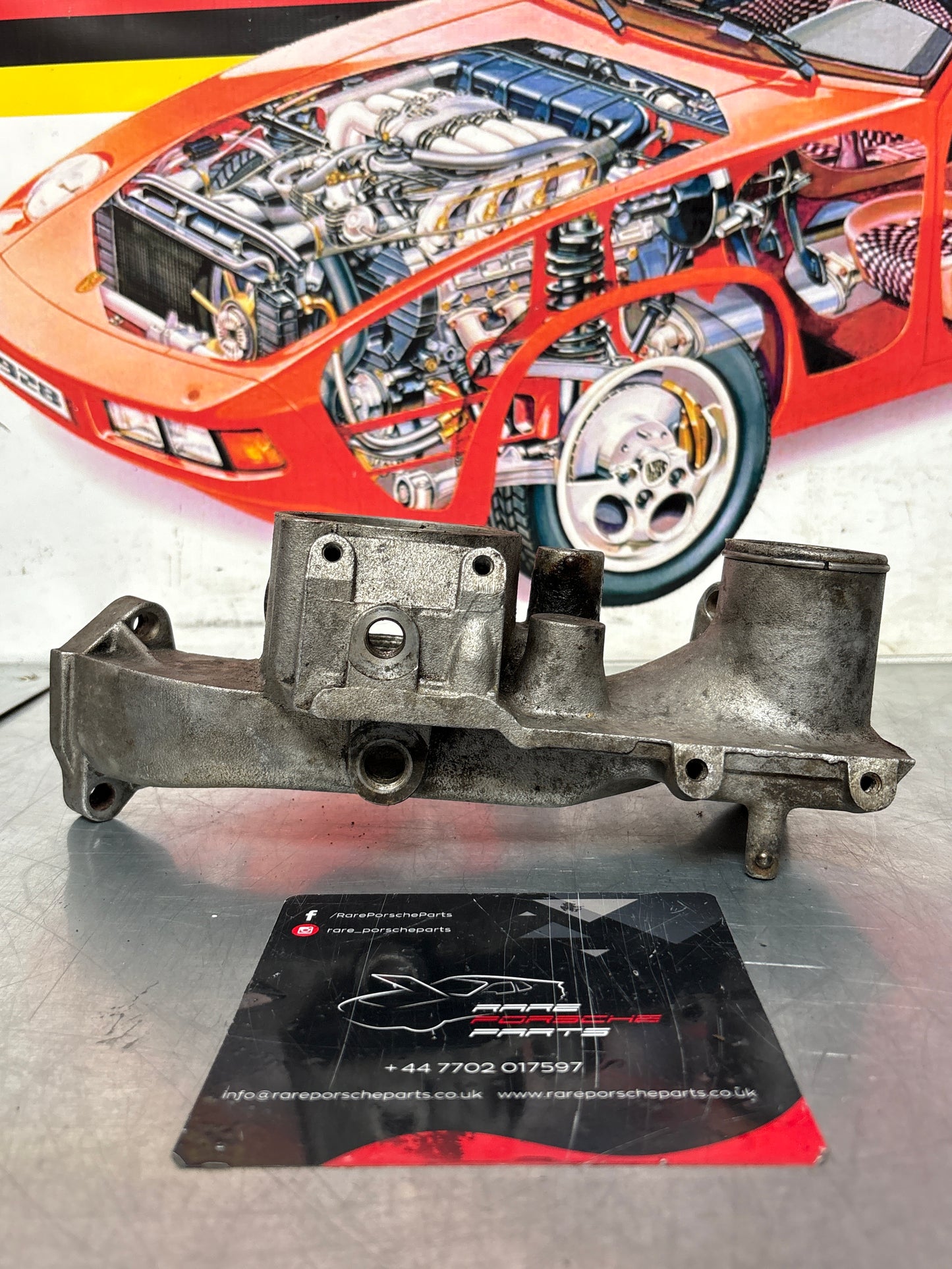 Porsche 928 thermostat housing, used 9281061616R