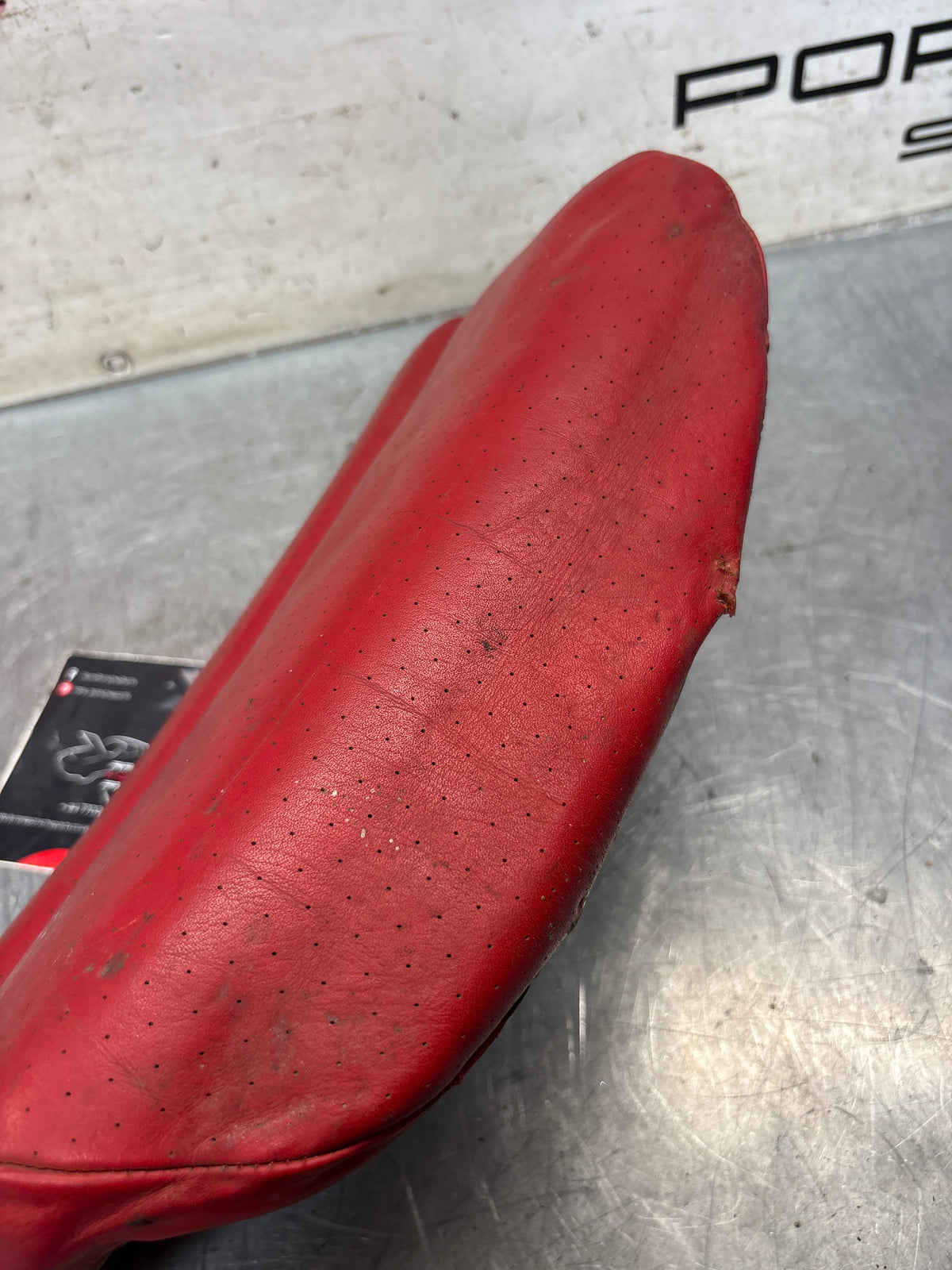 Porsche 928 rear left seat cushion, can-can red , leather, used 92852205951