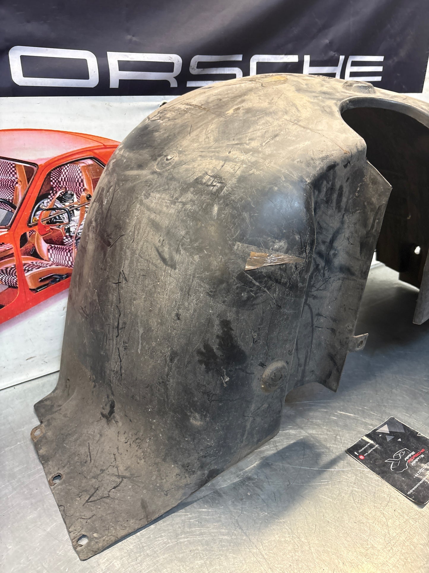 Porsche 944 from 85.5 wheel arch liner  Left, 94450438101 Used