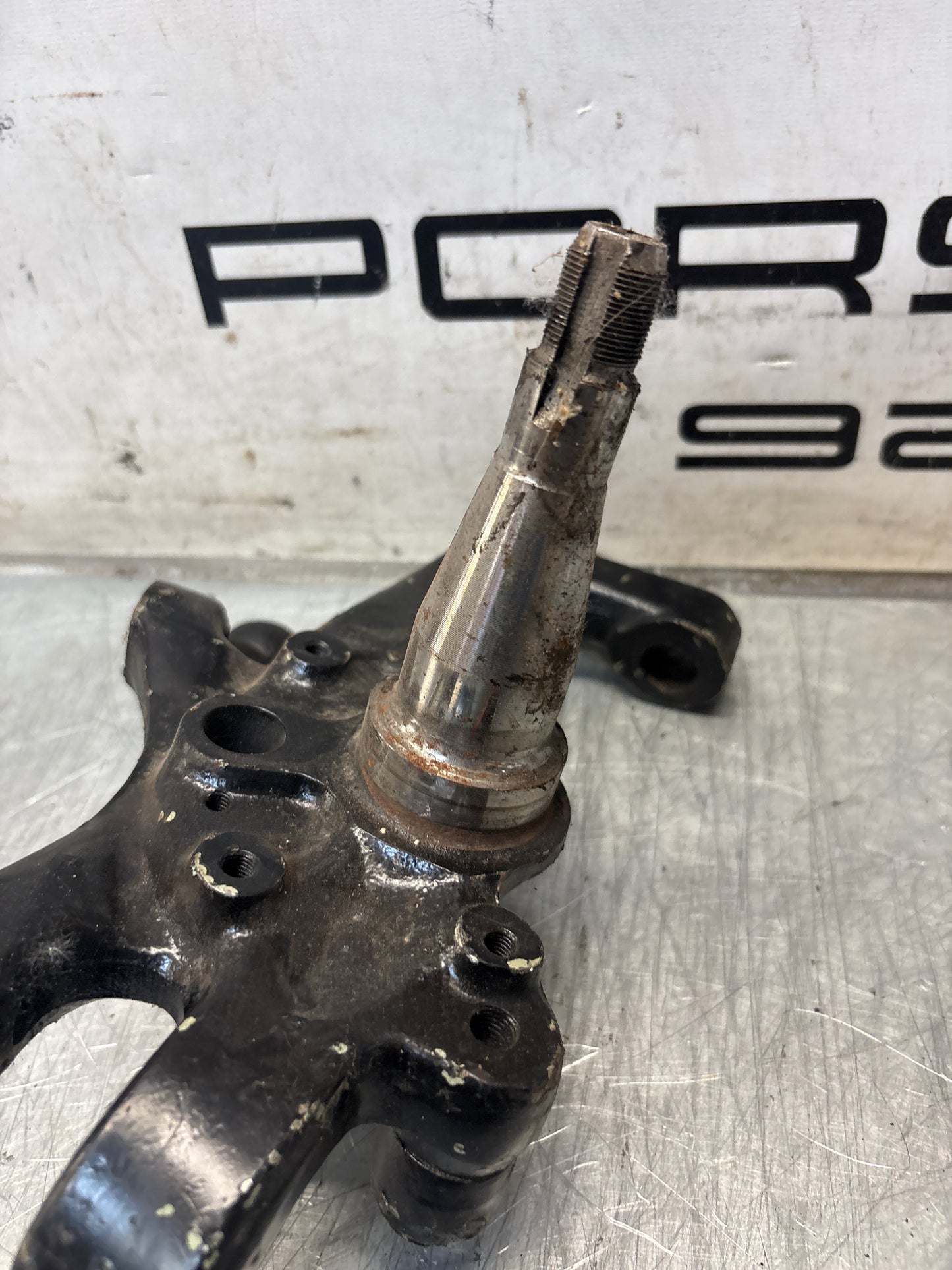 Porsche 928 left steering spindle knuckle, used 92834105717 / 92834105723