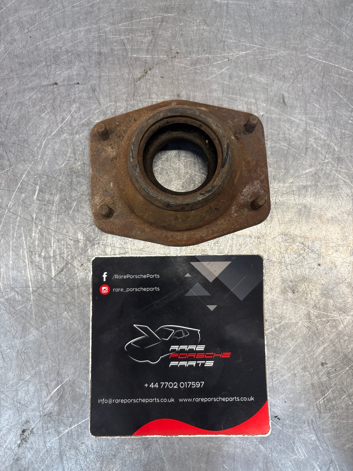 Porsche 924 / 944 front suspension bearing flange, 477412345, used