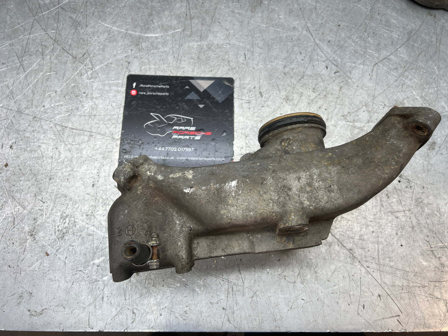 Porsche 928 thermostat housing, used 9281061614R