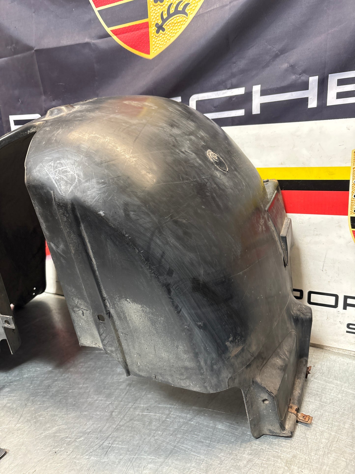 Porsche 944 from 85.5 wheel arch liner  Left, 94450438101 Used