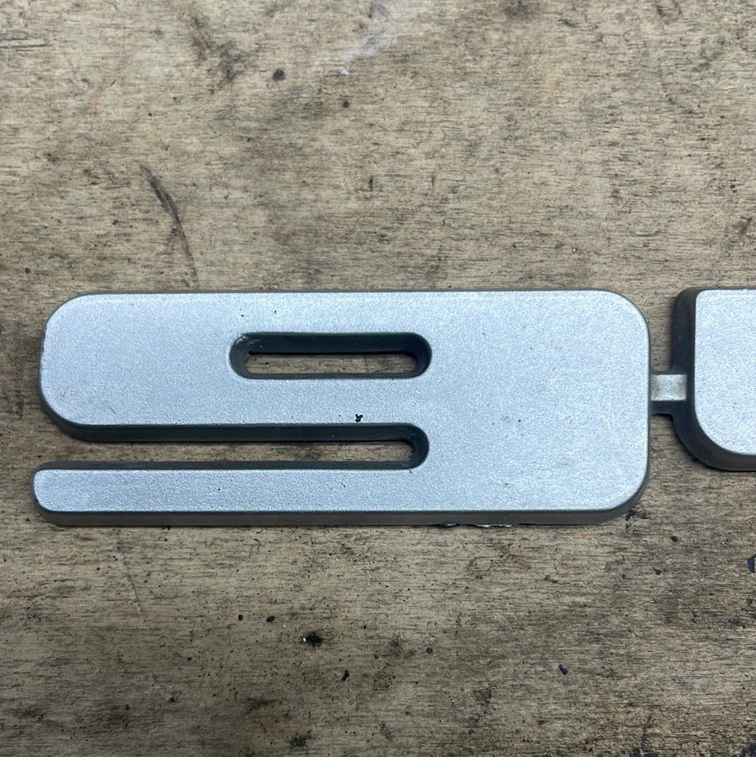 Porsche 944. rear hatch badge. original in silver