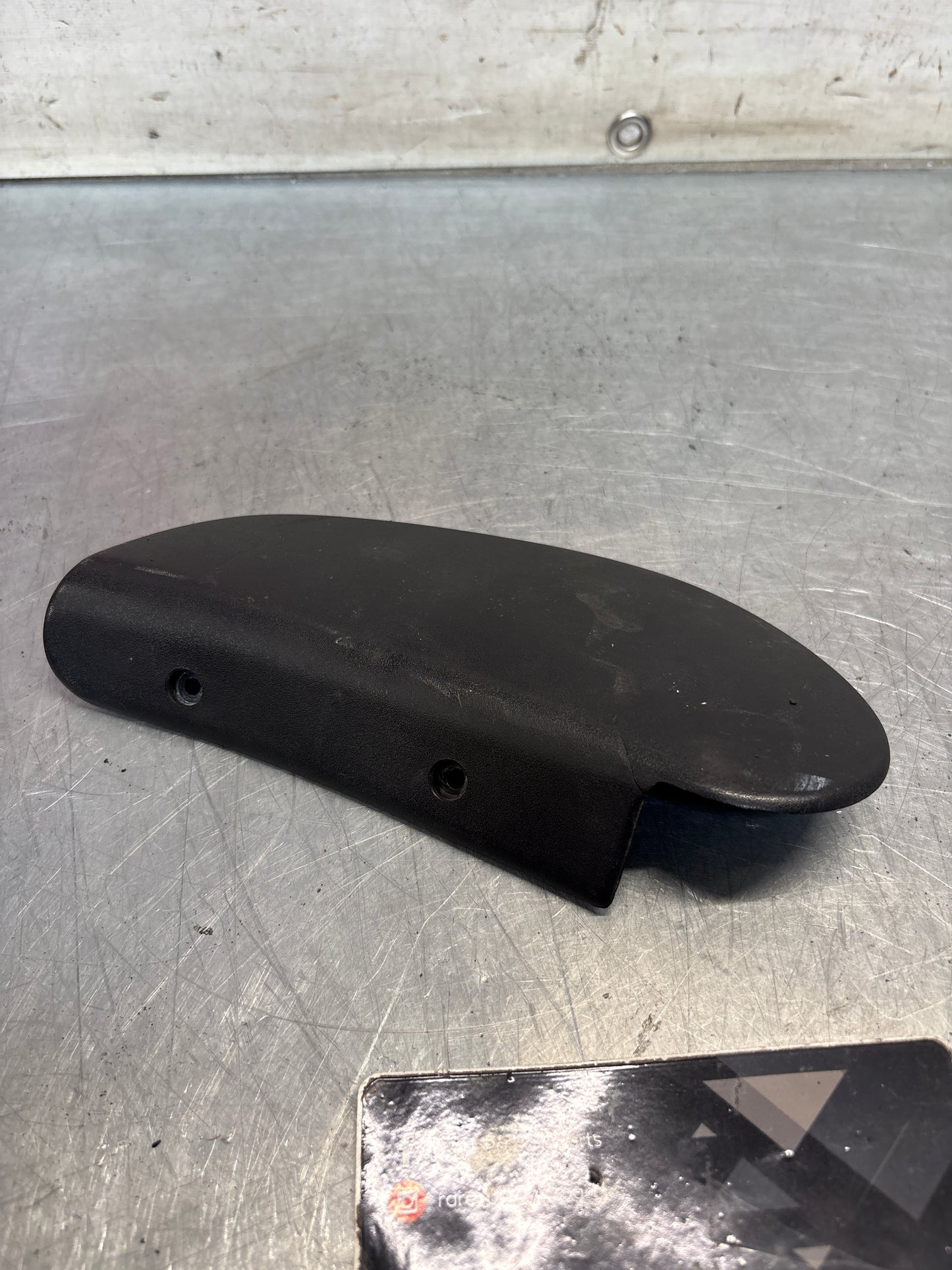 Porsche 928 seat hinge cover black used,cracked 92852114802