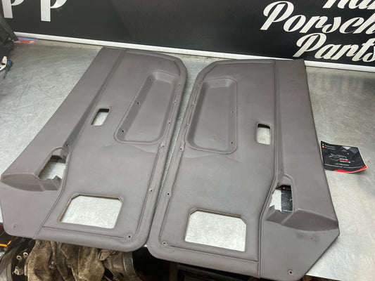 Porsche 944 85.5- pair of late UsedPorsche grey door cards, 94455501701 / 94455501801 used