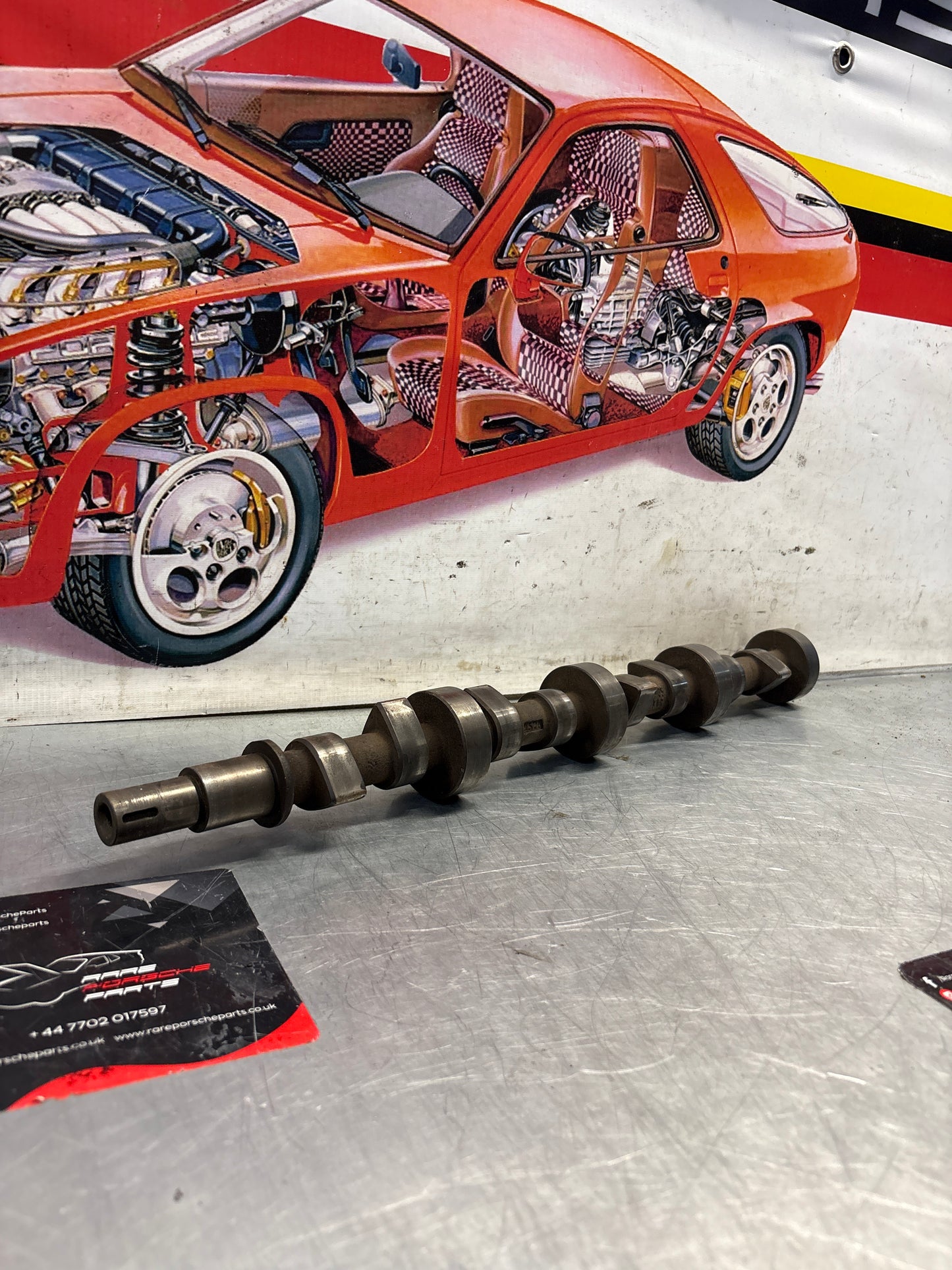 Porsche 928 cam shaft, used 9281052030R