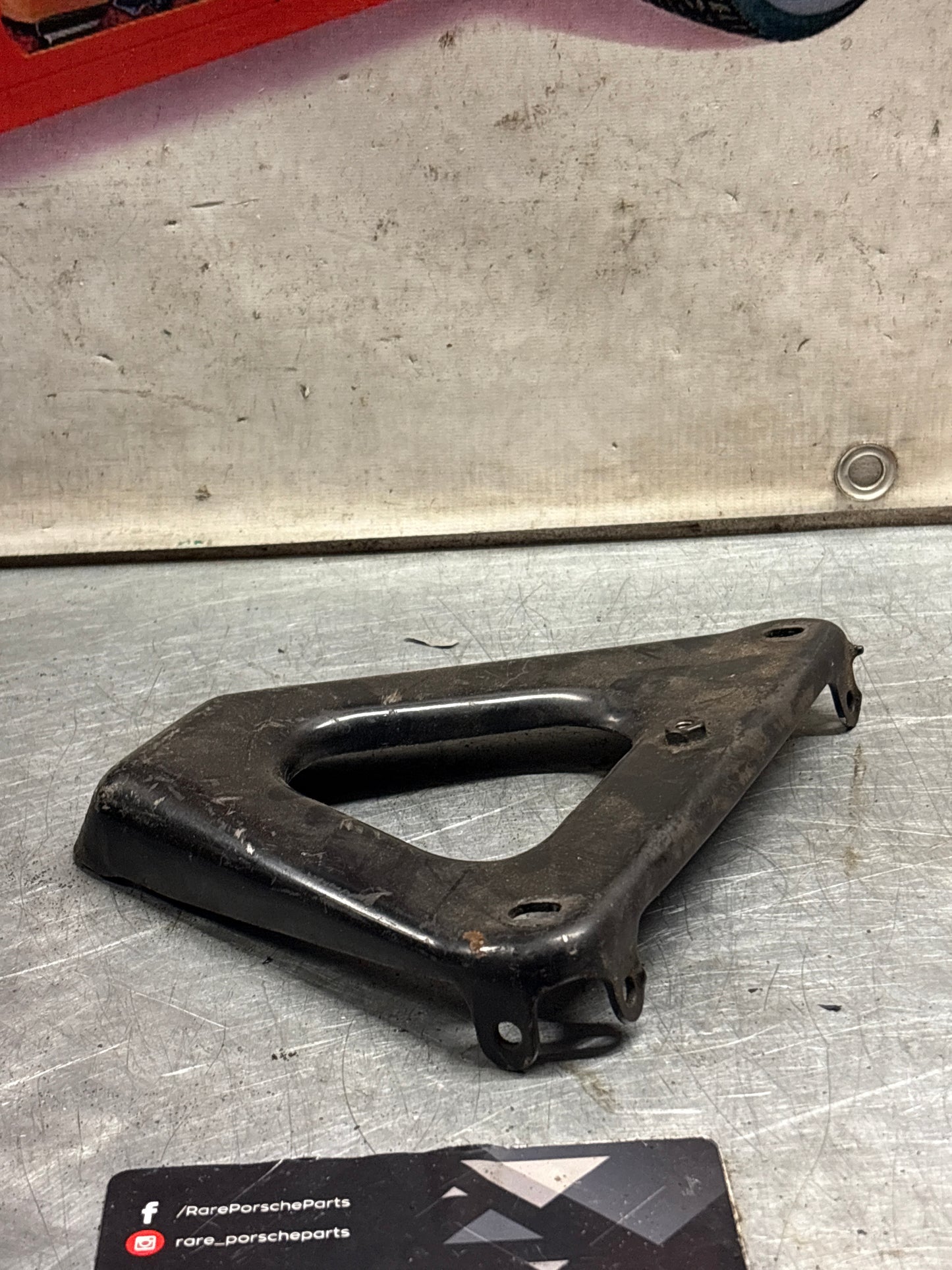 Porsche 924 exhaust manifold support bracket, used 93111014501