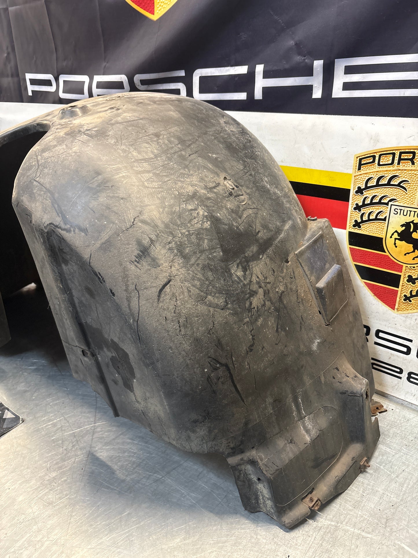 Porsche 944 from 85.5 wheel arch liner  Left, 94450438101 Used