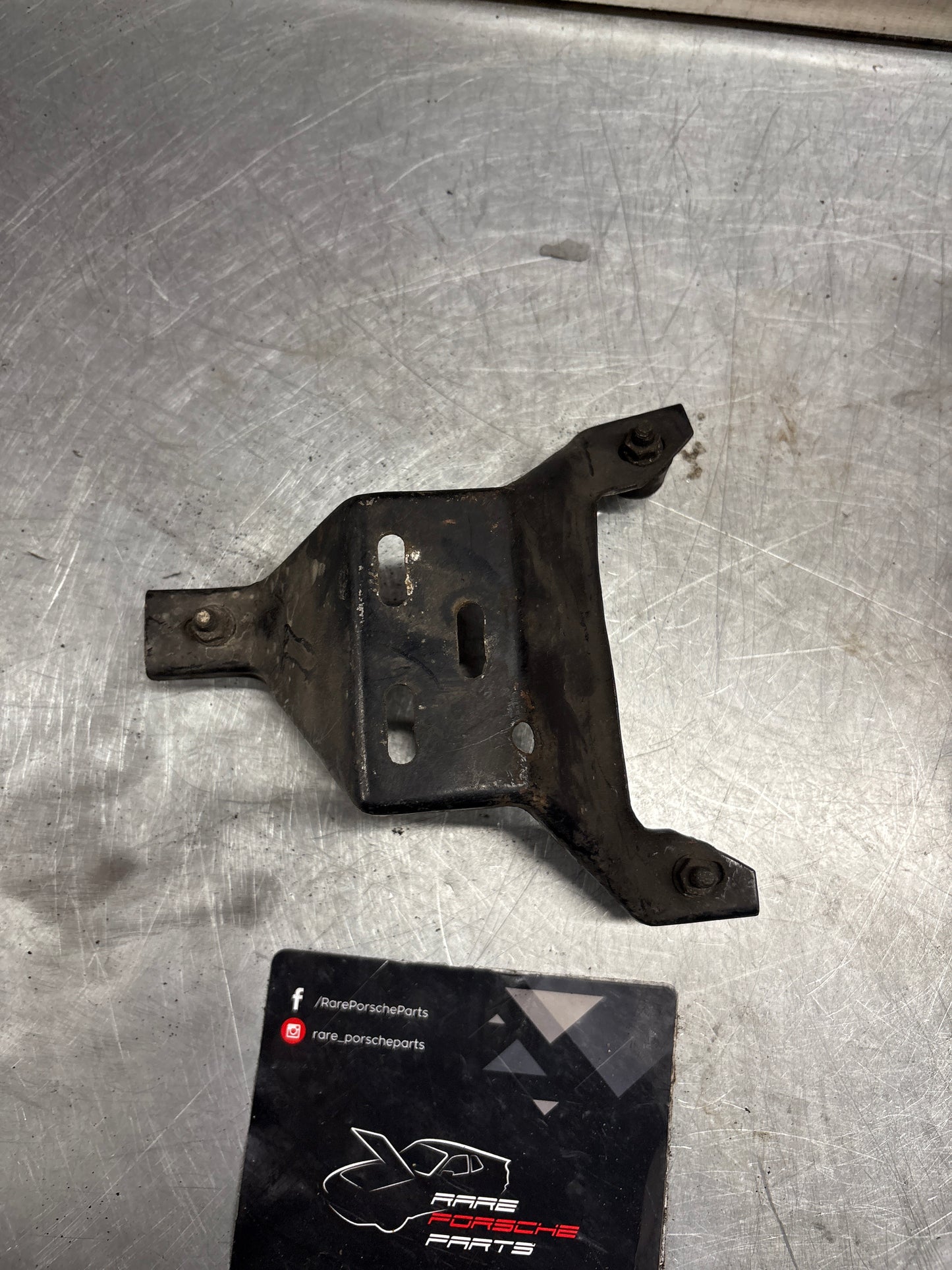 Porsche 924 Turbo air filter housing support bracket 477805513, used