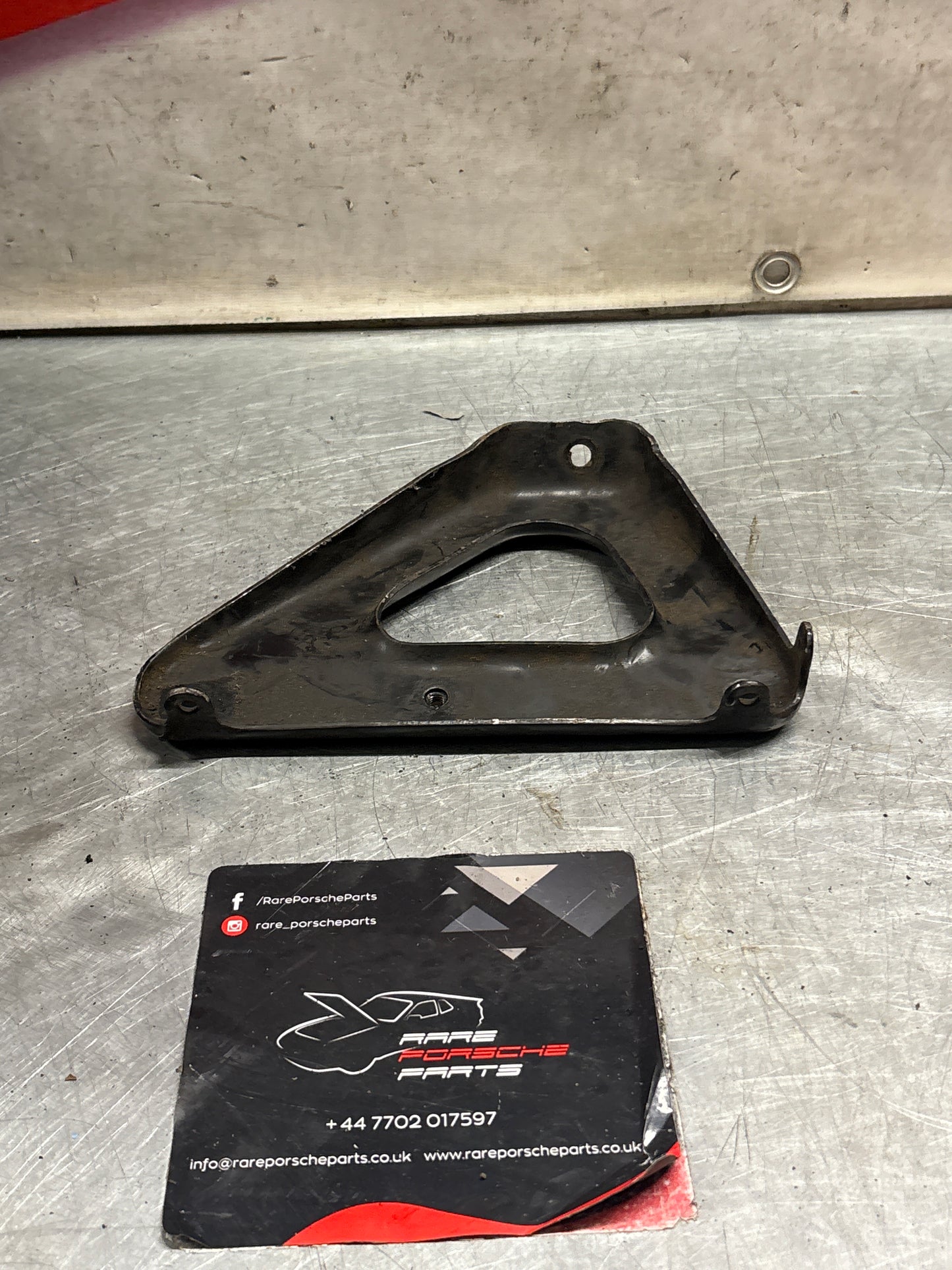 Porsche 924 exhaust manifold support bracket, used 93111014501