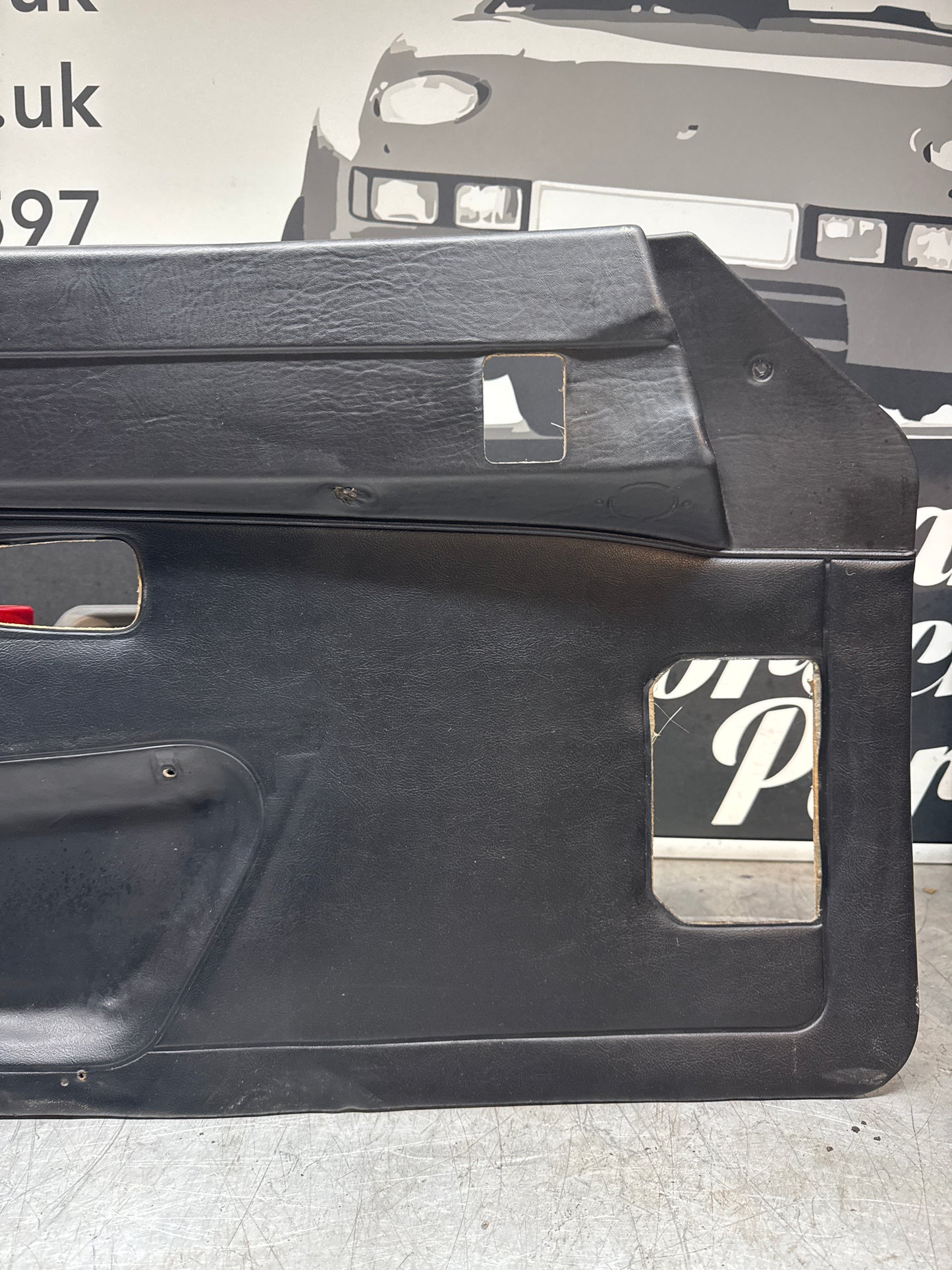 Porsche 924/ Early 944 black RHD Left door card. Fibreglass repaired. 477867012