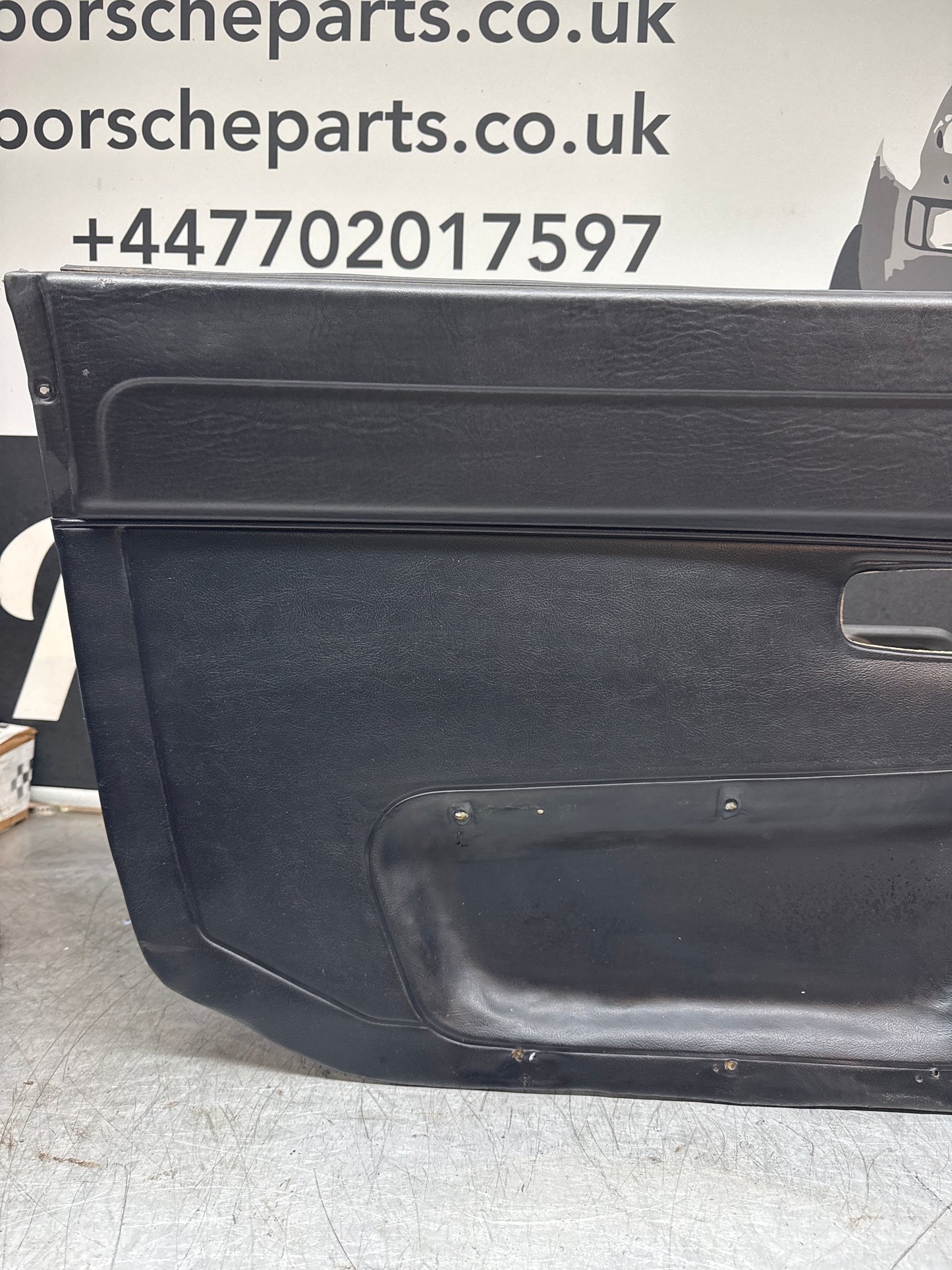 Porsche 924/ Early 944 black RHD Left door card. Fibreglass repaired. 477867012