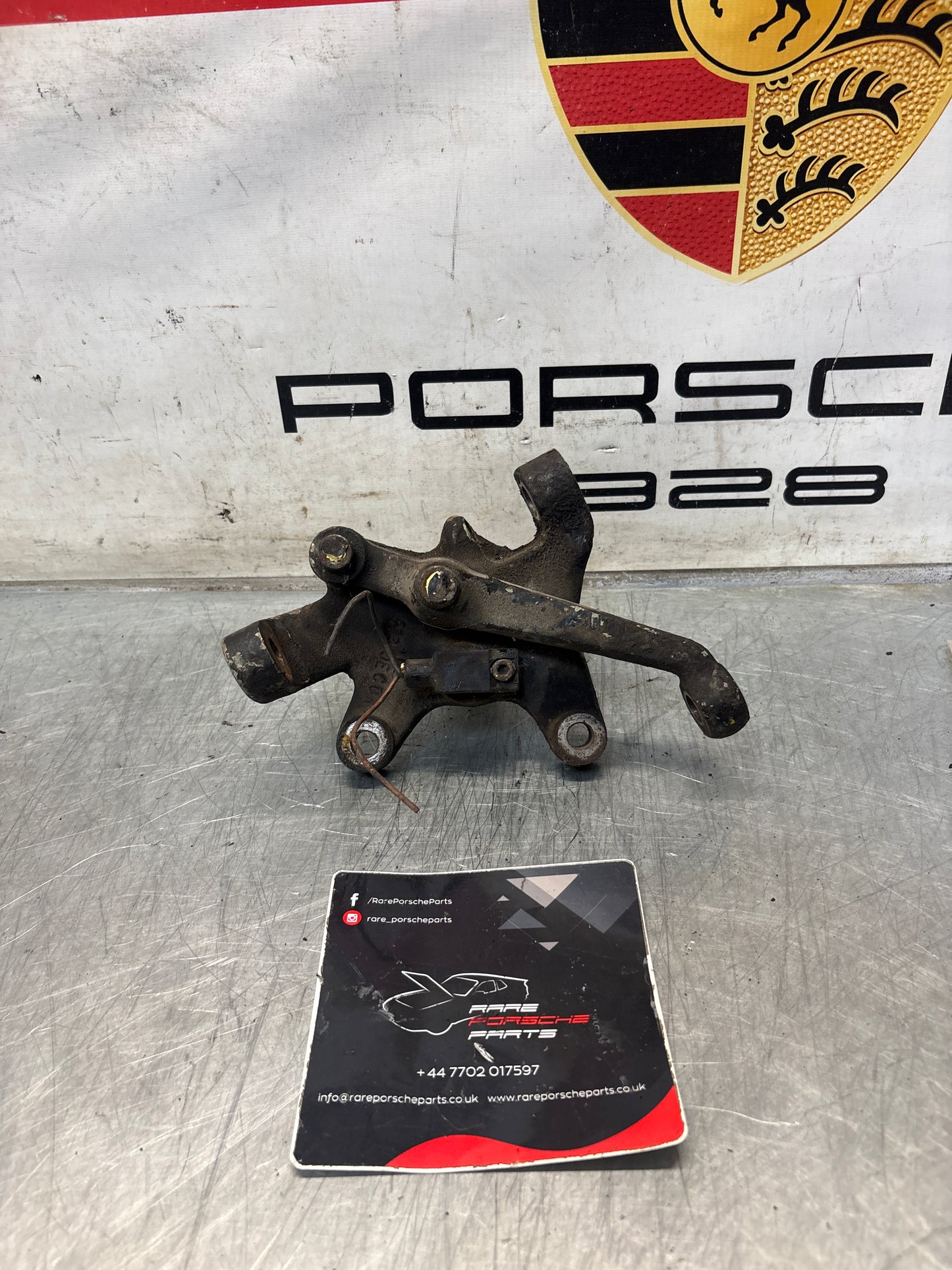 Porsche 928 left steering spindle knuckle, used 92834105717