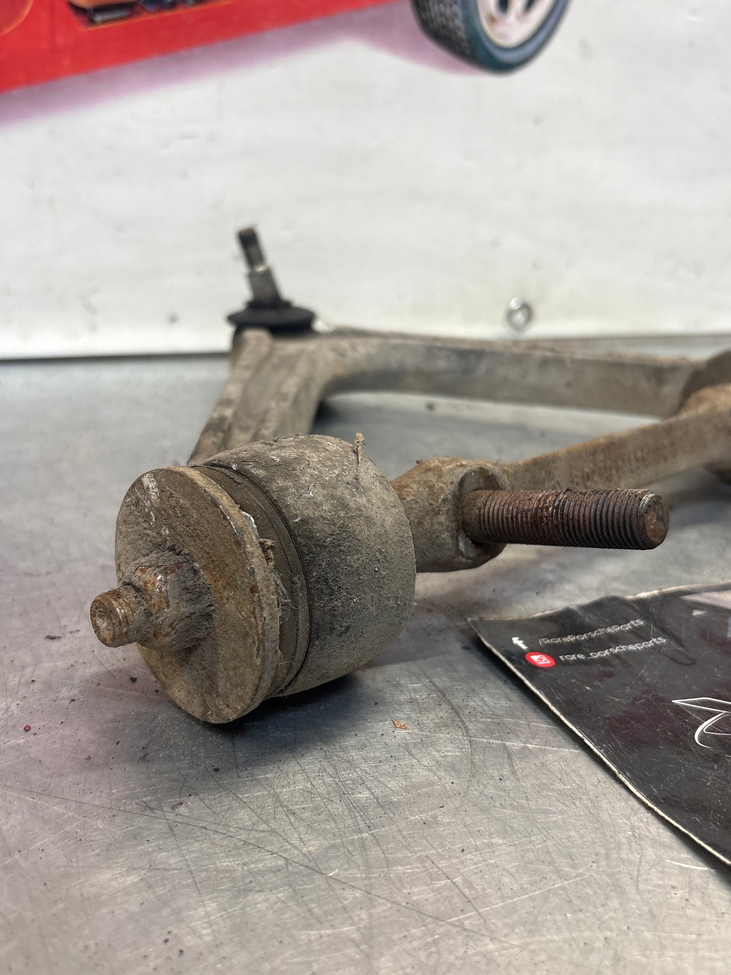 Porsche 928 front upper left control arm, used 92834145722