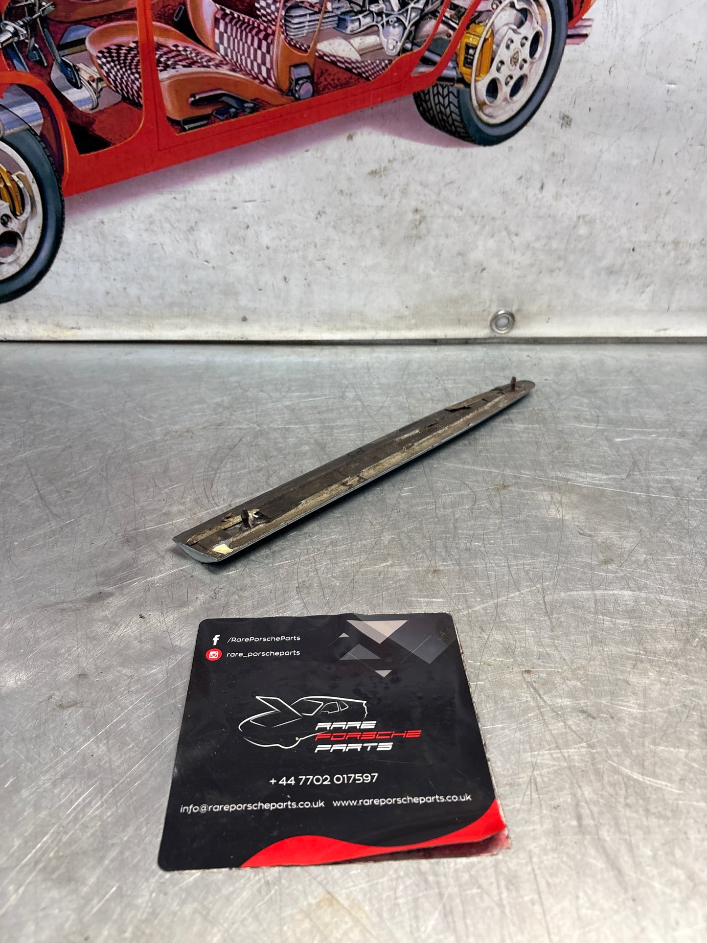 Porsche 928 left side front wing molding trim, used 92855903703