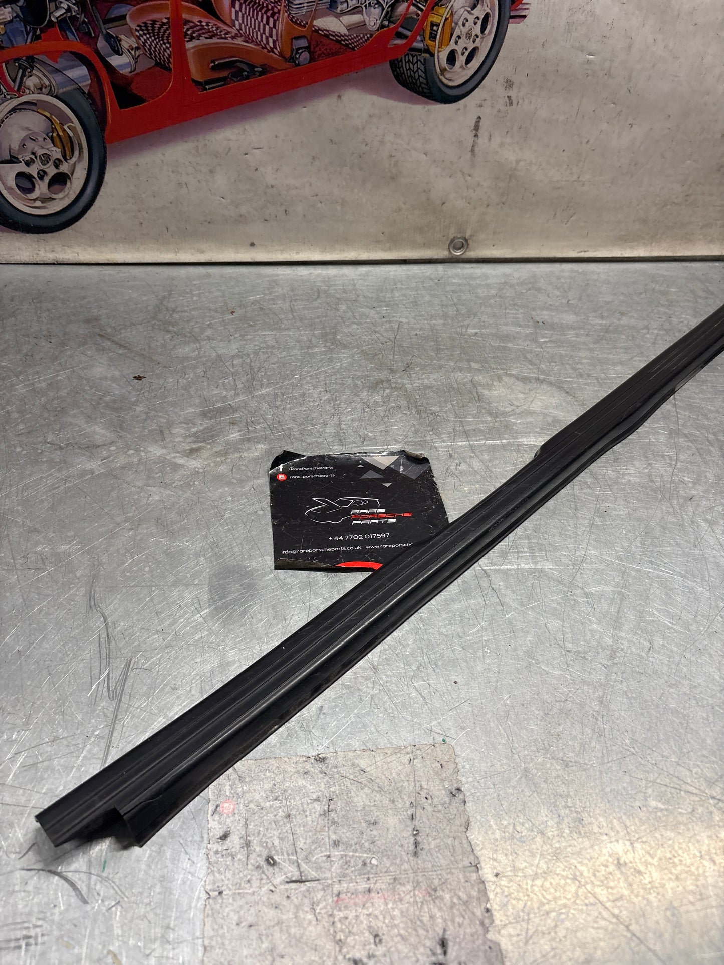 Porsche 944 85.5- left sill trim, scuff plate used 94455112100 cracked
