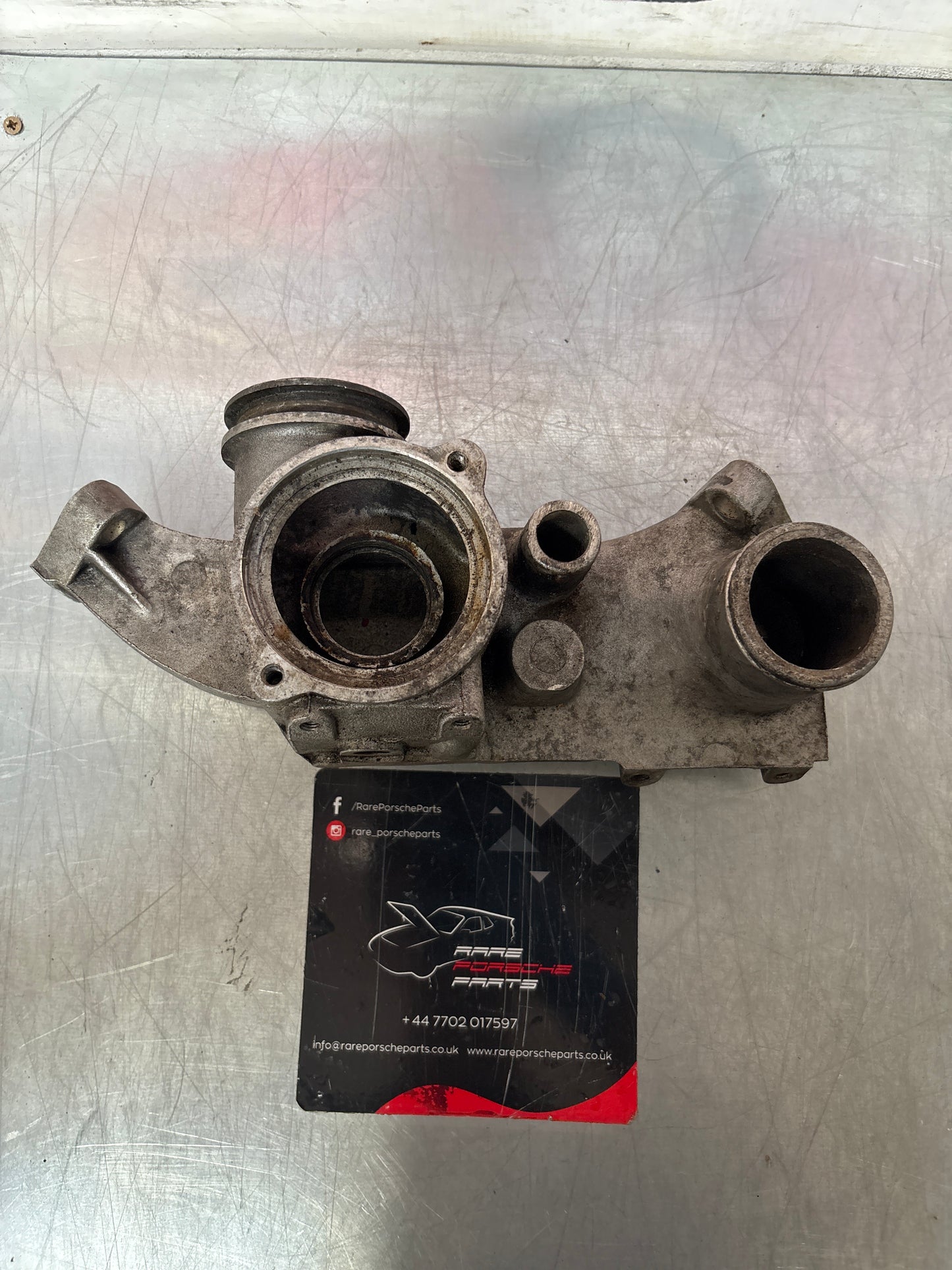 Porsche 928 thermostat housing, used 9281061616R