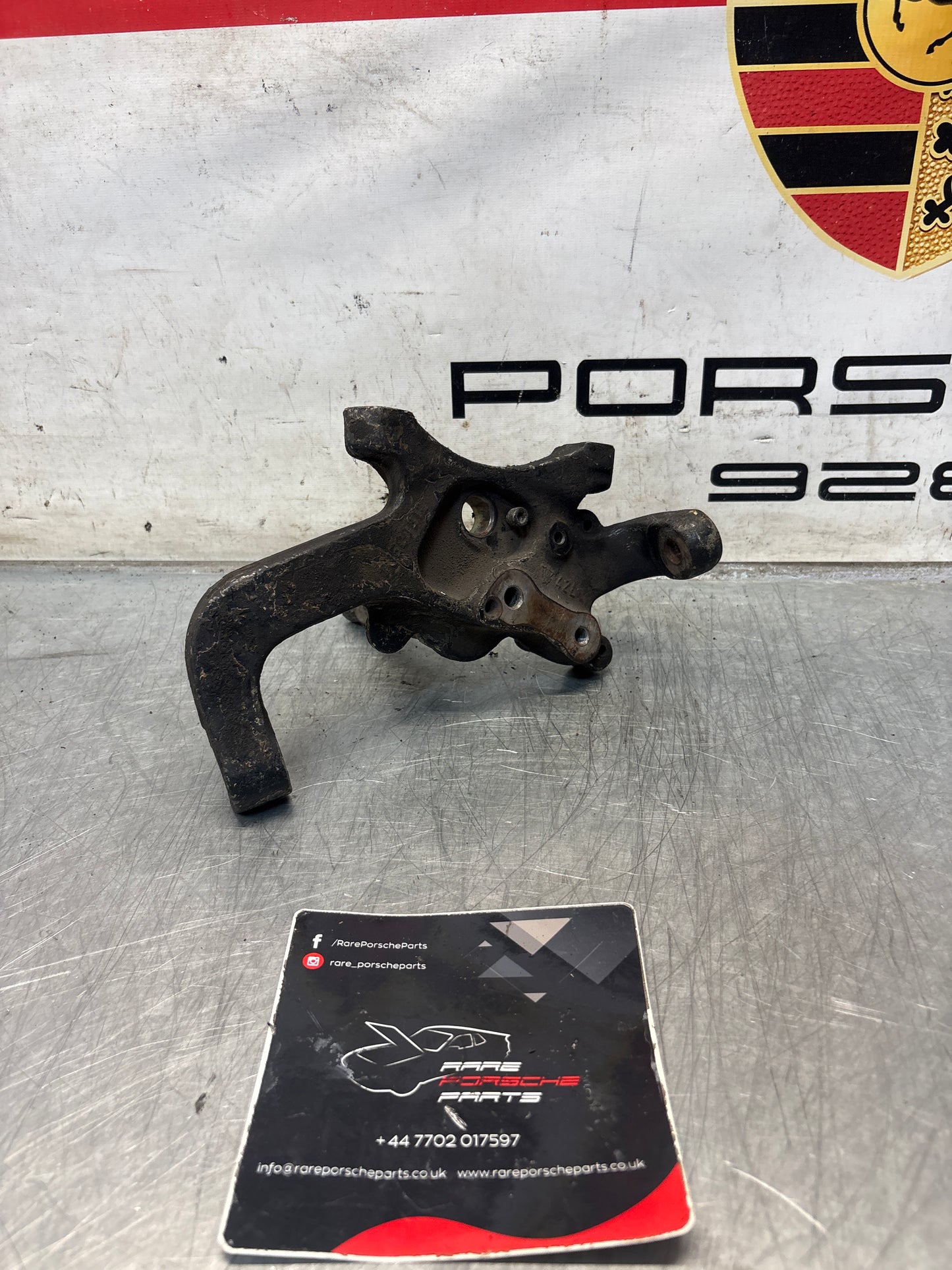 Porsche 928 left steering spindle knuckle, used 92834105717 / 92834105723