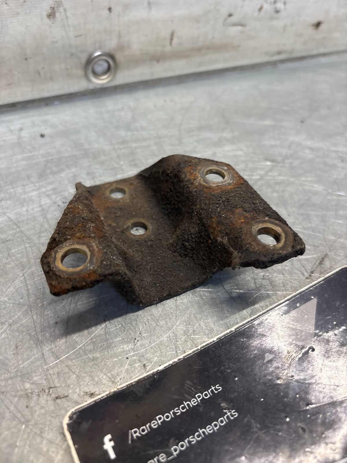 Porsche 924 944 hook trestle bracket, left, used 477399167E