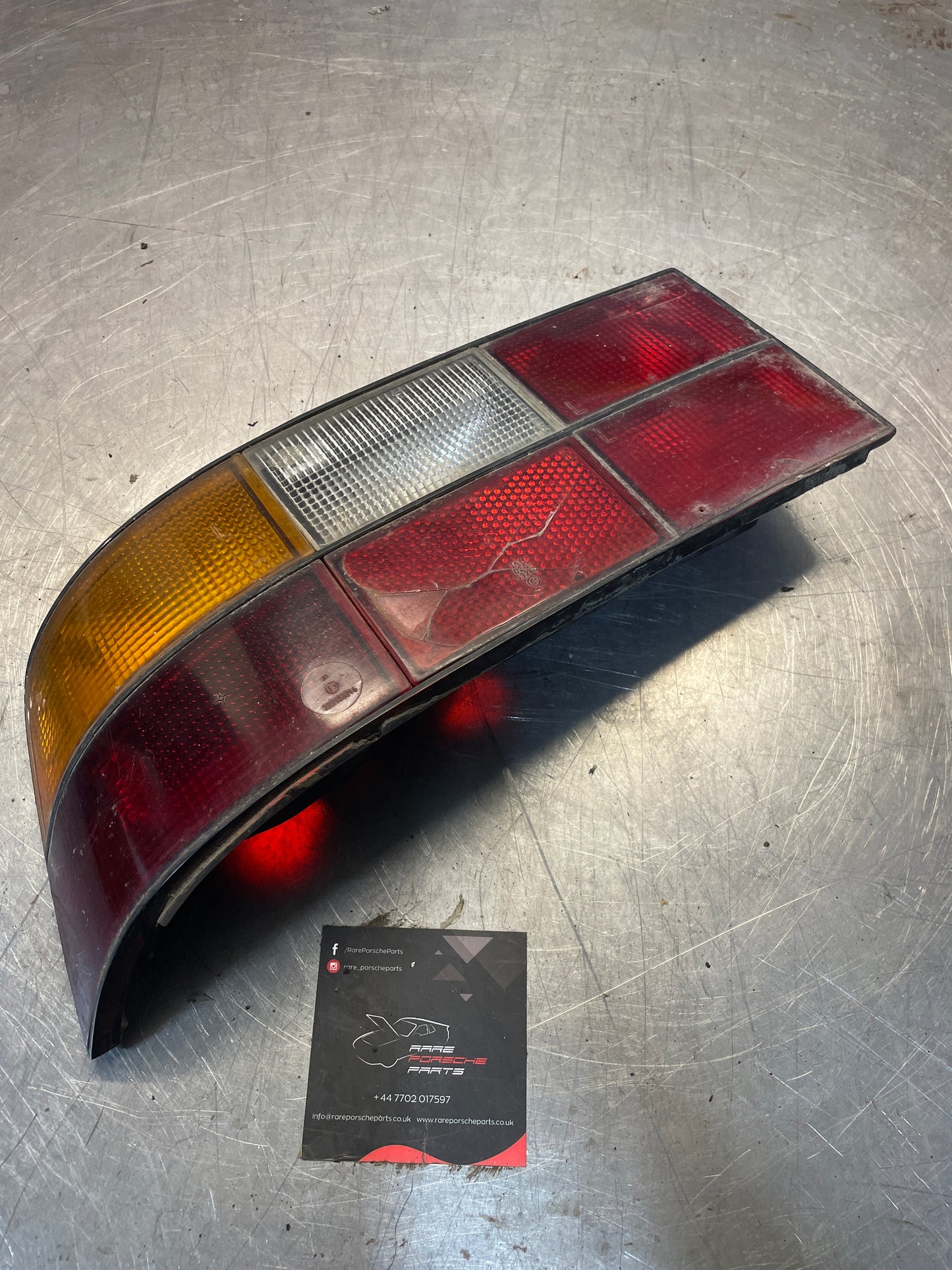 Porsche 924 / 944 left tail light, used, cracked