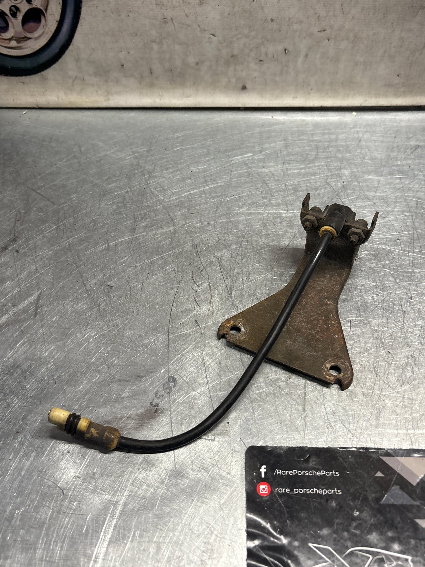 Porsche 928 tire pressure gauge with support bracket, used 92834108501