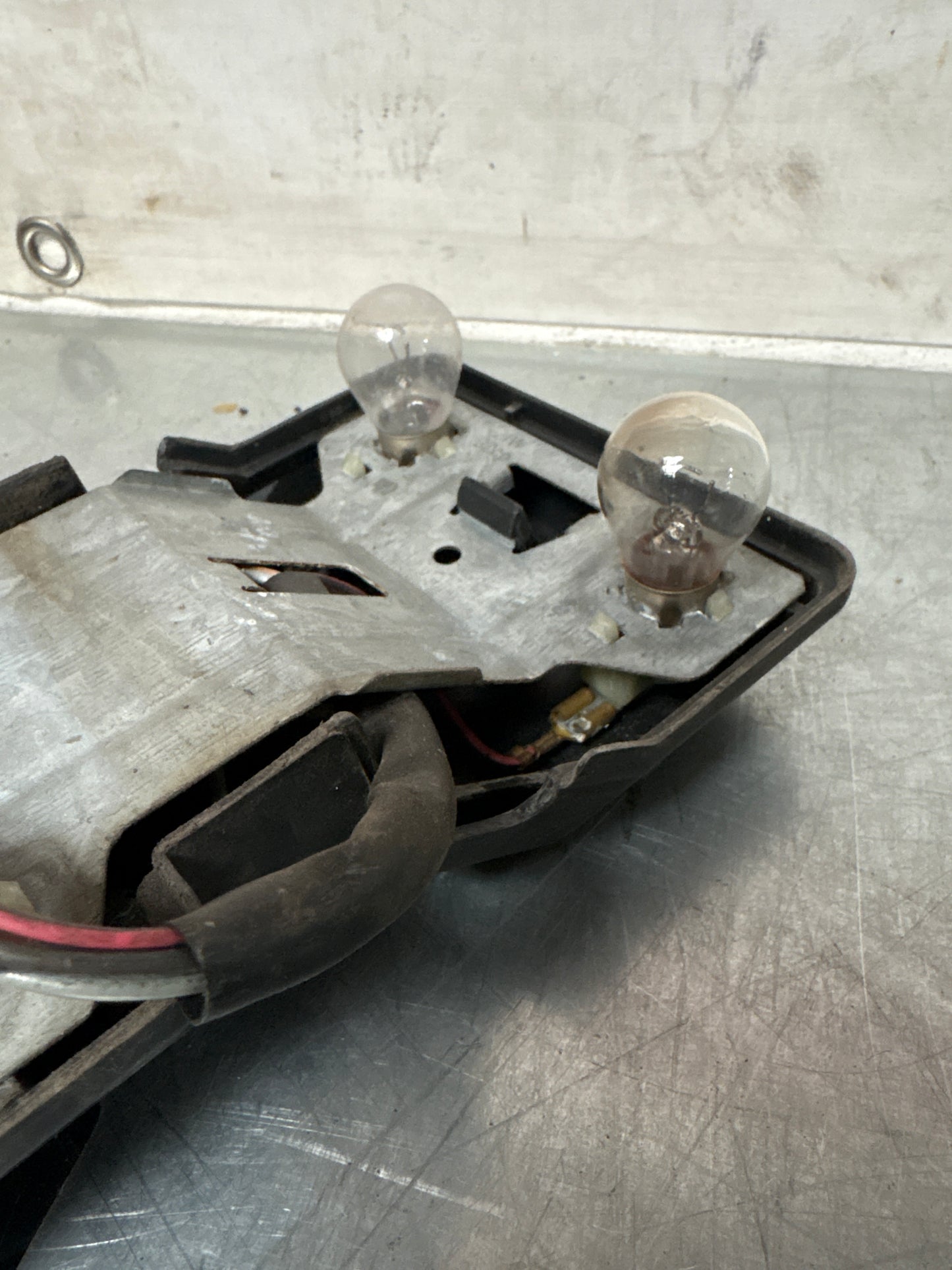 Porsche 944 rear left Tail light lamp bulb holder and cover, used 477945113