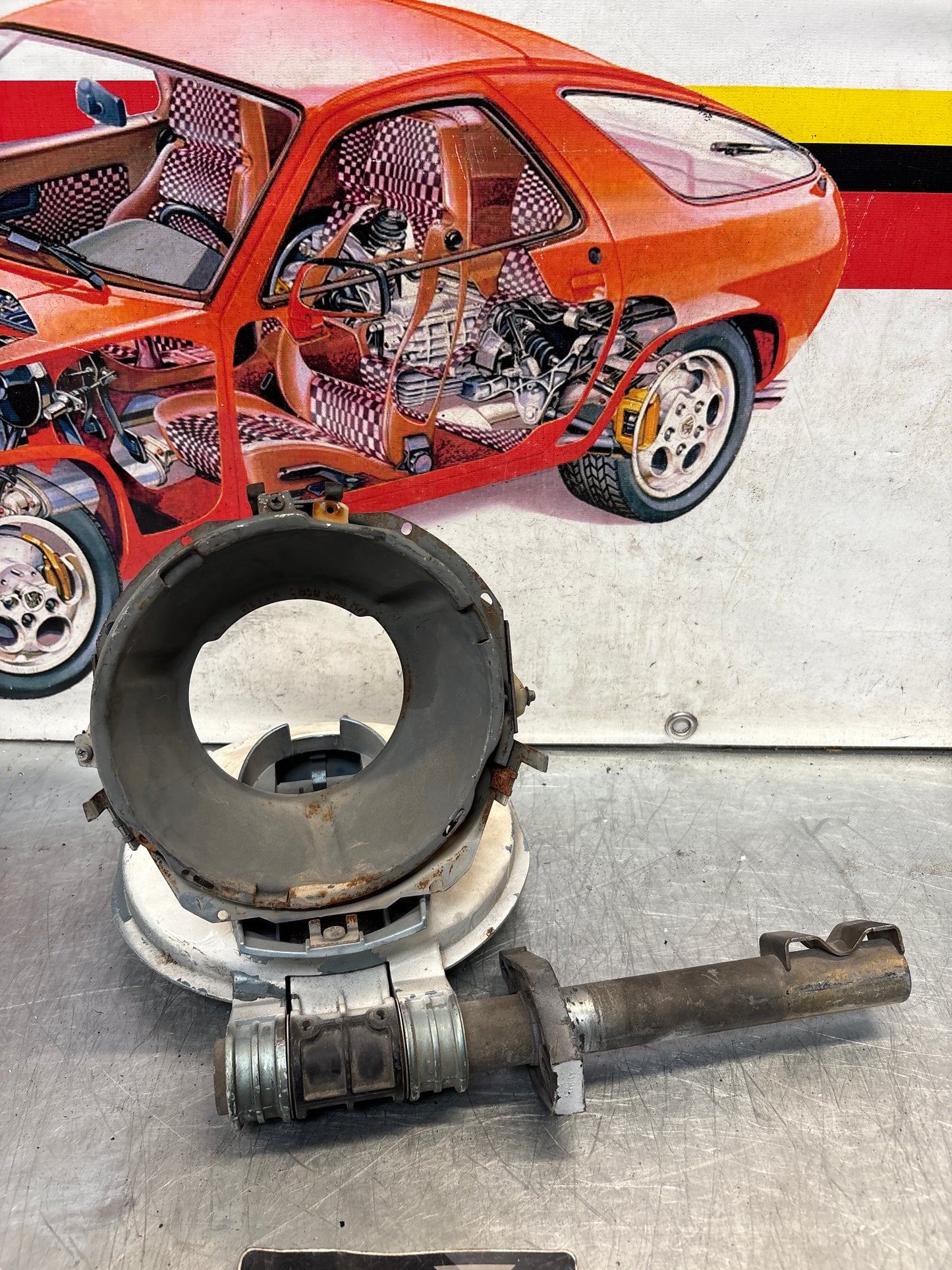 Porsche 928 left headlight swivel frame 92875024902 92875024302 used