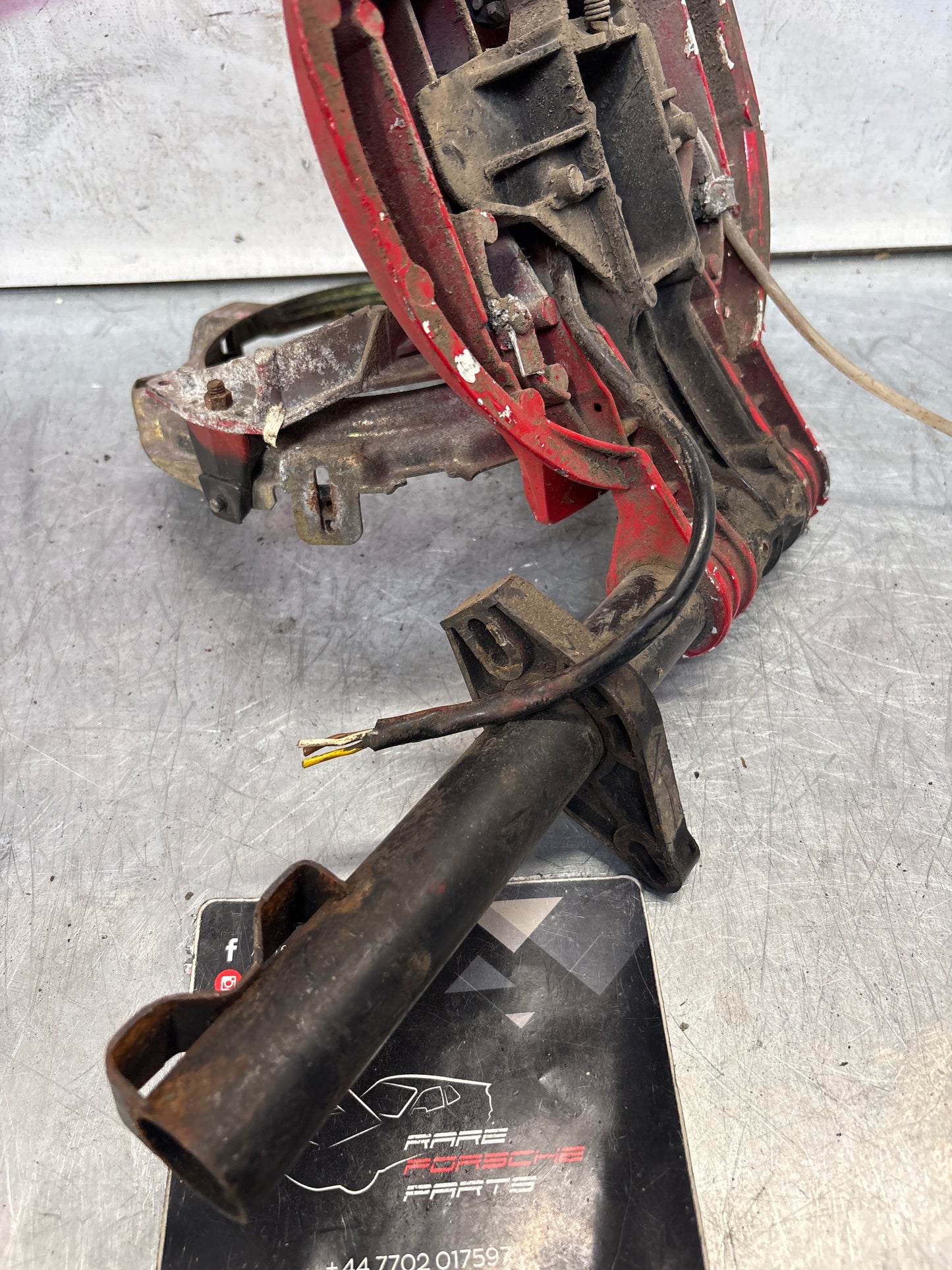 Porsche 928 left headlight swivel frame 92875024902 92875024302 used