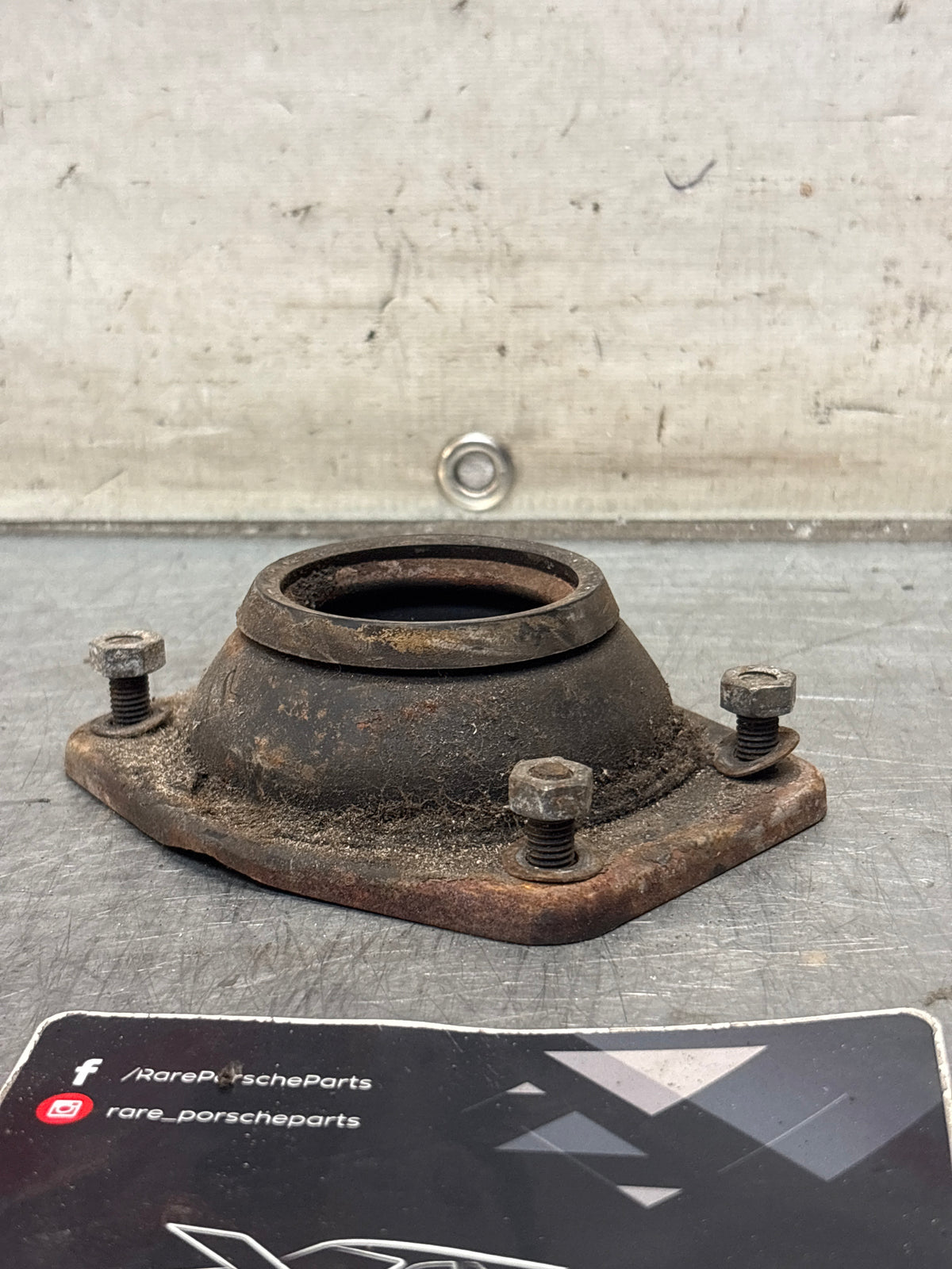 Porsche 924 / 944 front suspension bearing flange, 477412345, used