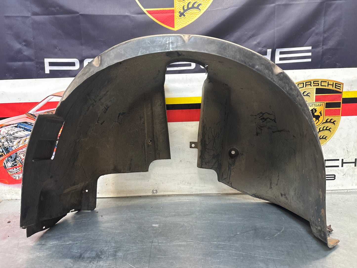 Porsche 944 from 85.5 wheel arch liner  Left, 94450438101 Used