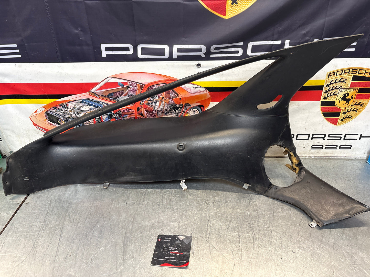 Porsche 928 early left side lower side trim panel, without loudspeaker, black used 92855502102