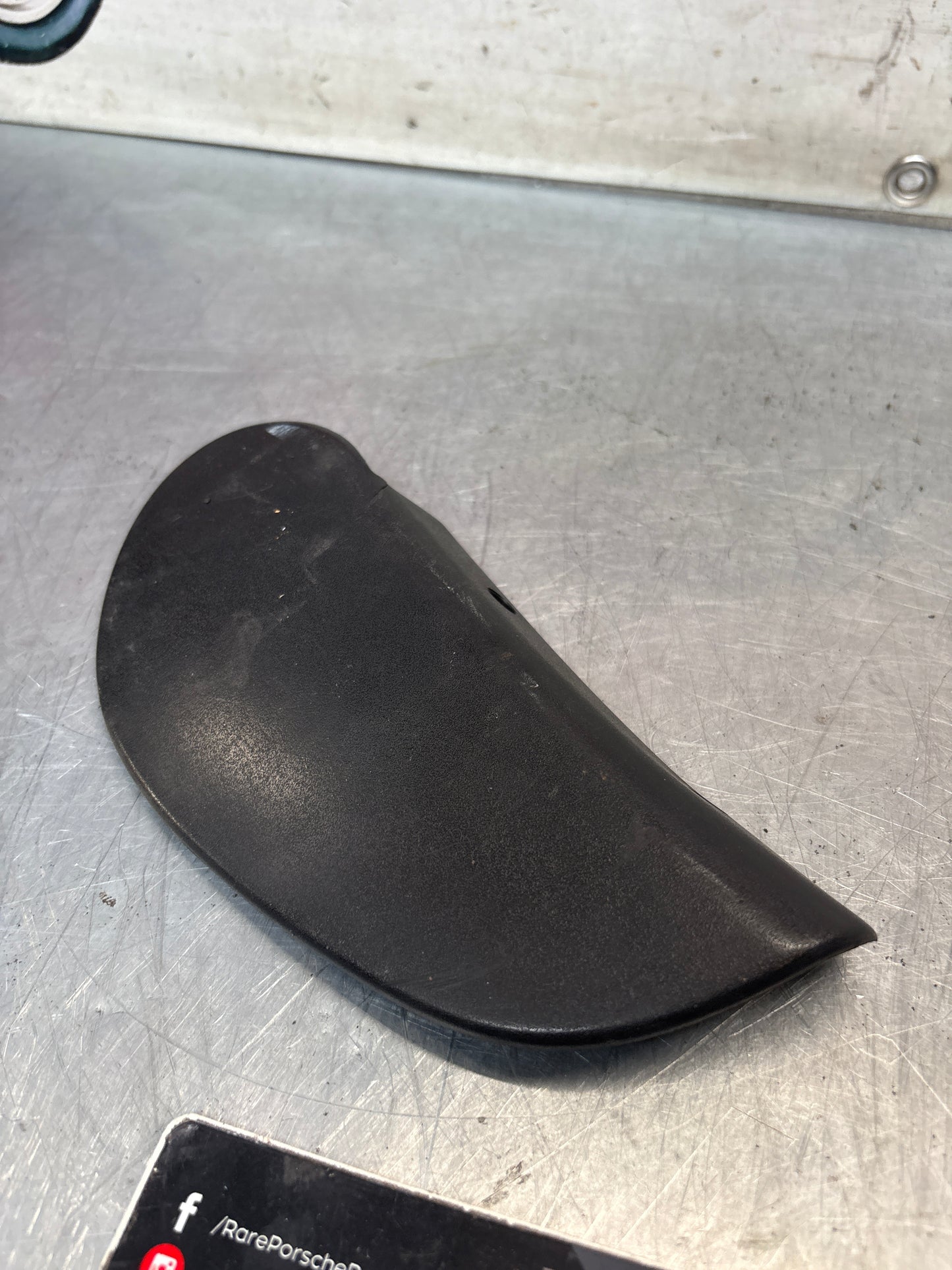 Porsche 928 seat hinge cover black used,cracked 92852114802