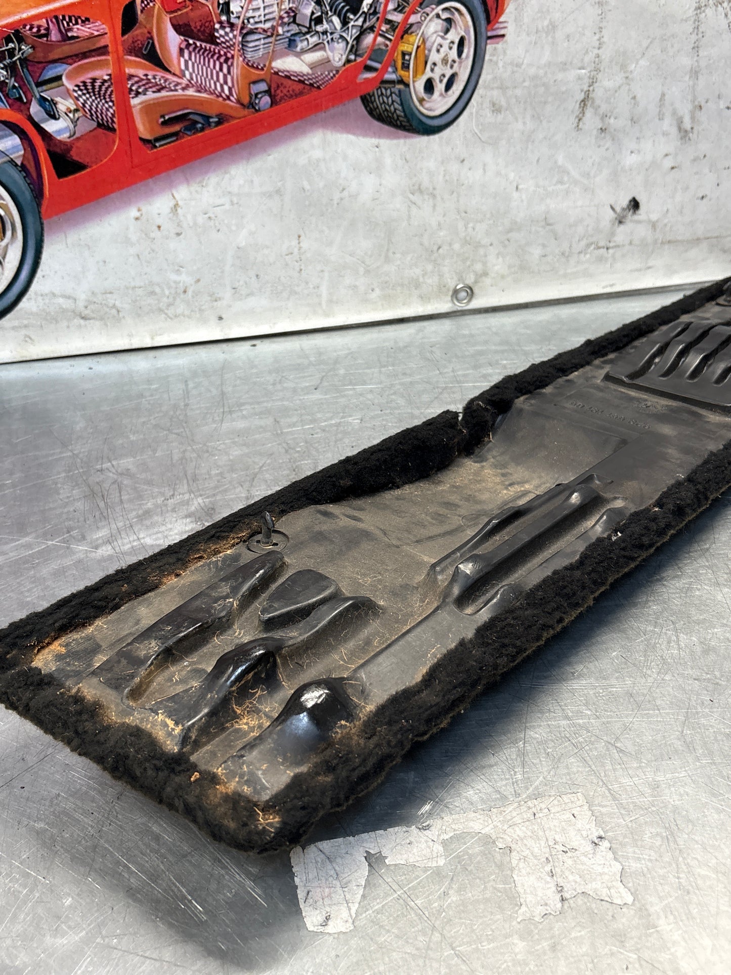 Porsche 928 black/grey-beige carpeted Tool kit panel cover, used 92855118105