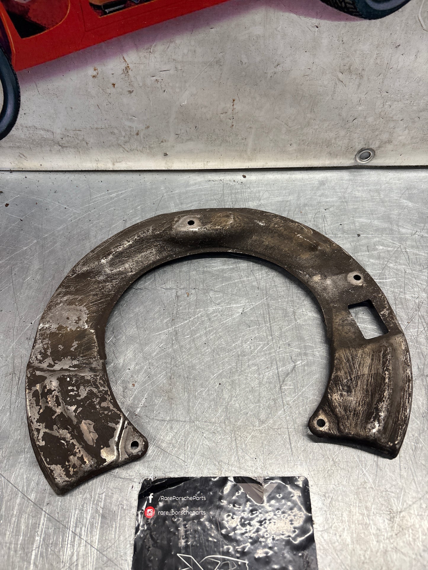 Porsche 928 S4 rear left brake dust cover plate, used 92835281305
