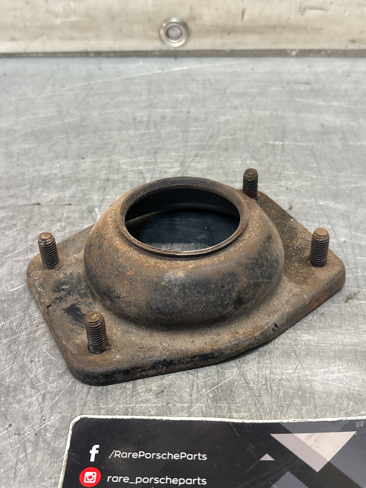 Porsche 924 / 944 front suspension bearing flange, 477412345, used