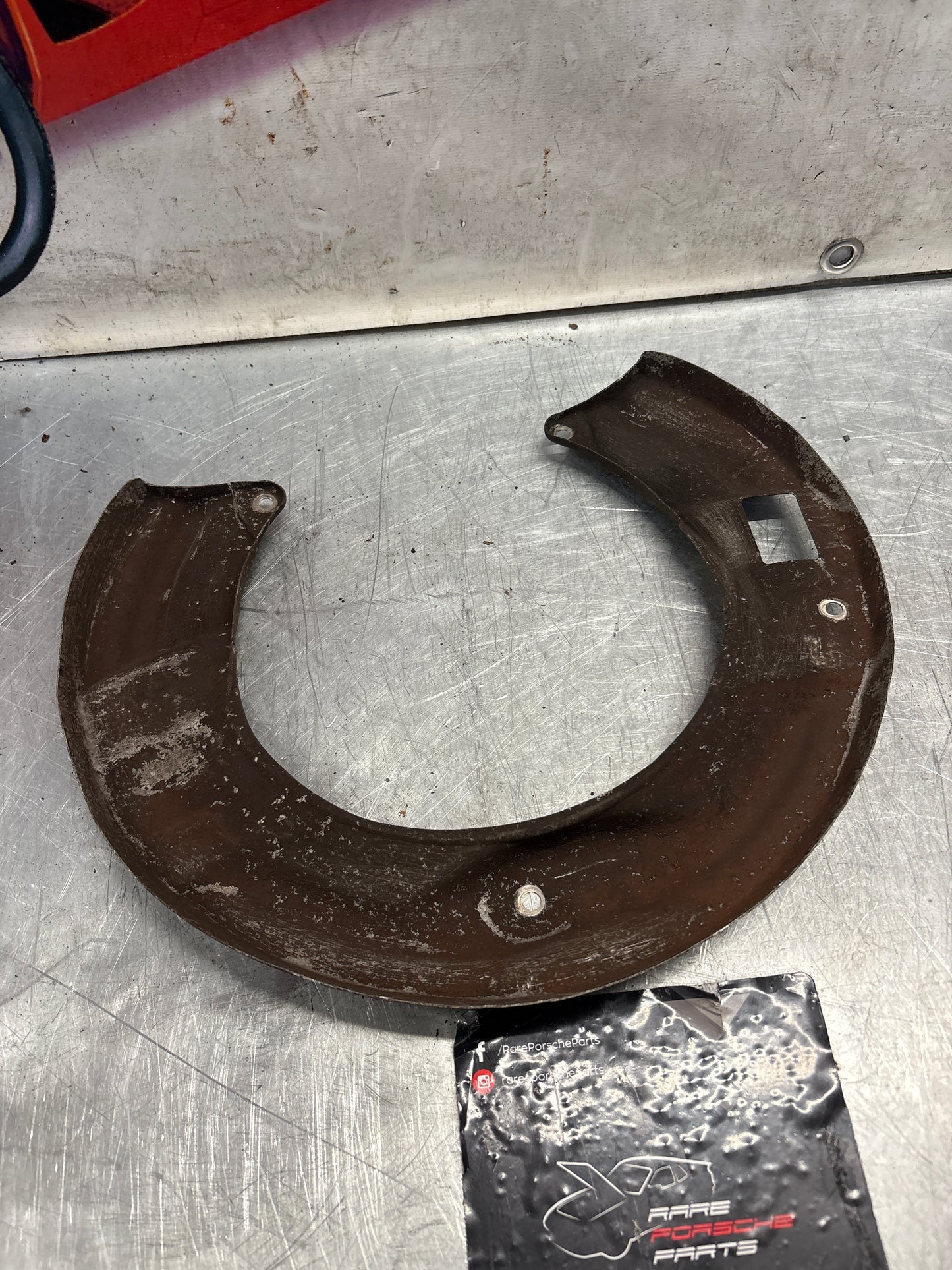 Porsche 928 S4 rear left brake dust cover plate, used 92835281305