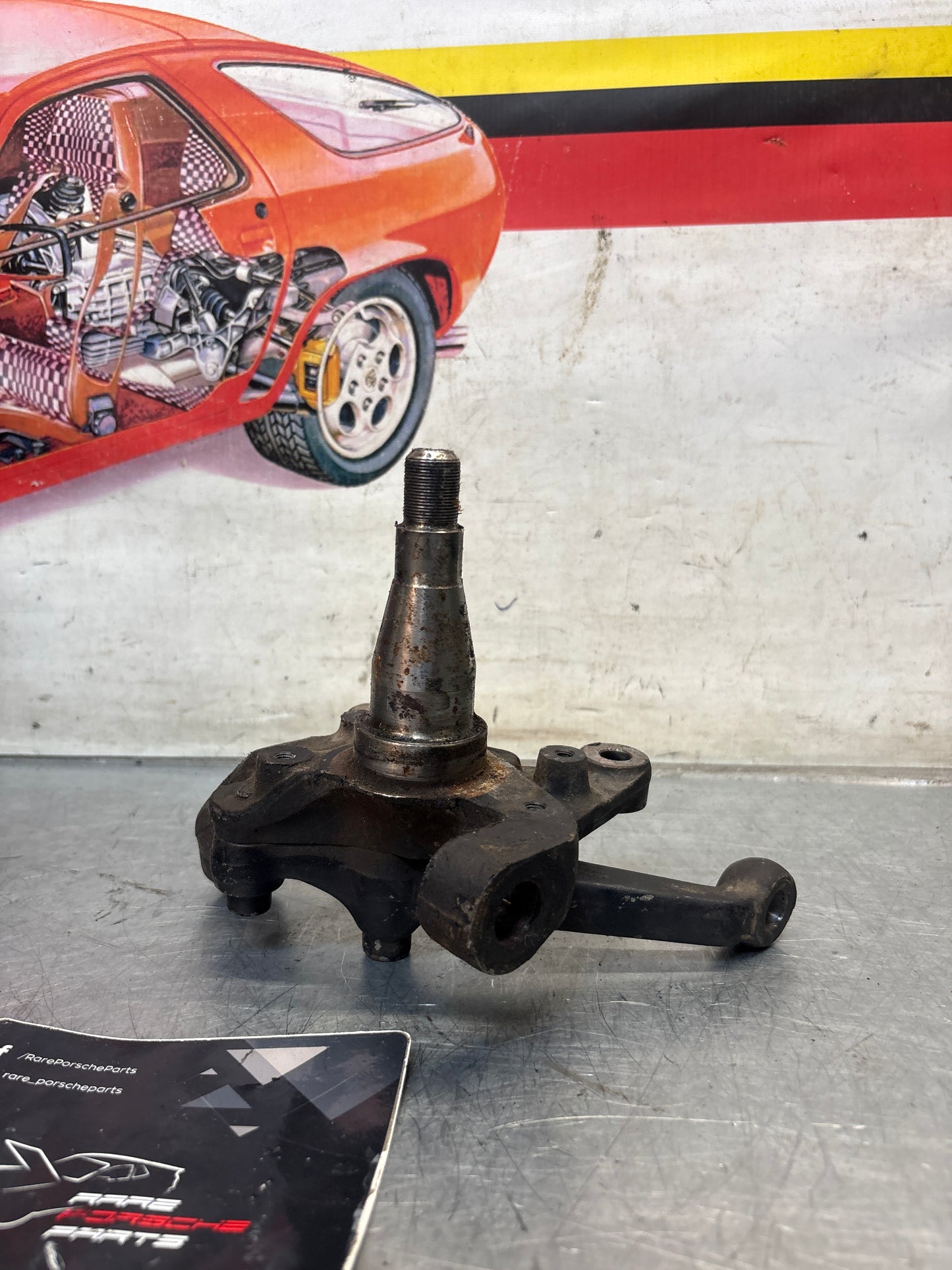 Porsche 928 left steering spindle knuckle, used 92834105713