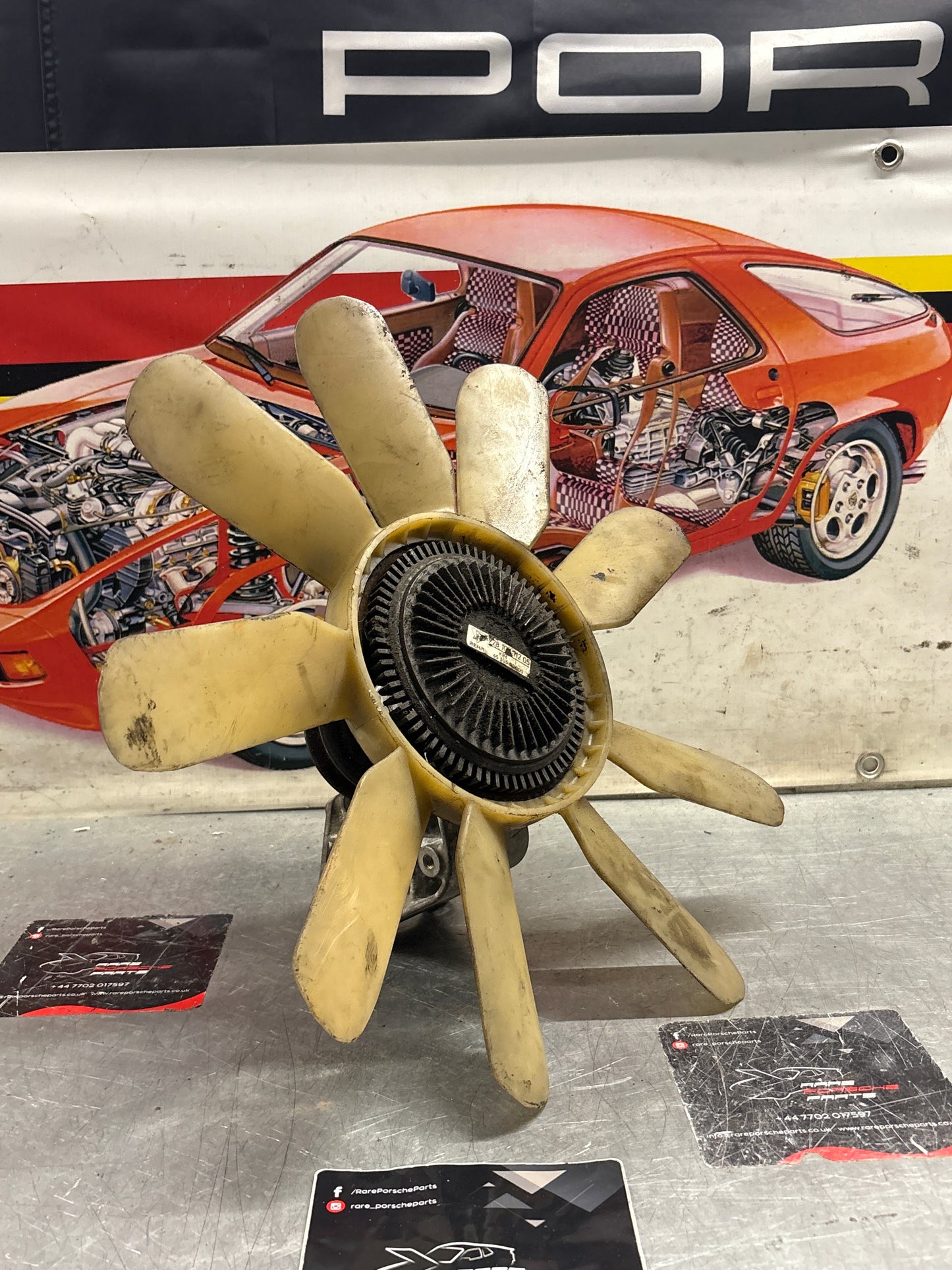 Porsche 928 late engine cooling fan clutch with bracket, used 92810611205 / 92810613701 / 9281061104R