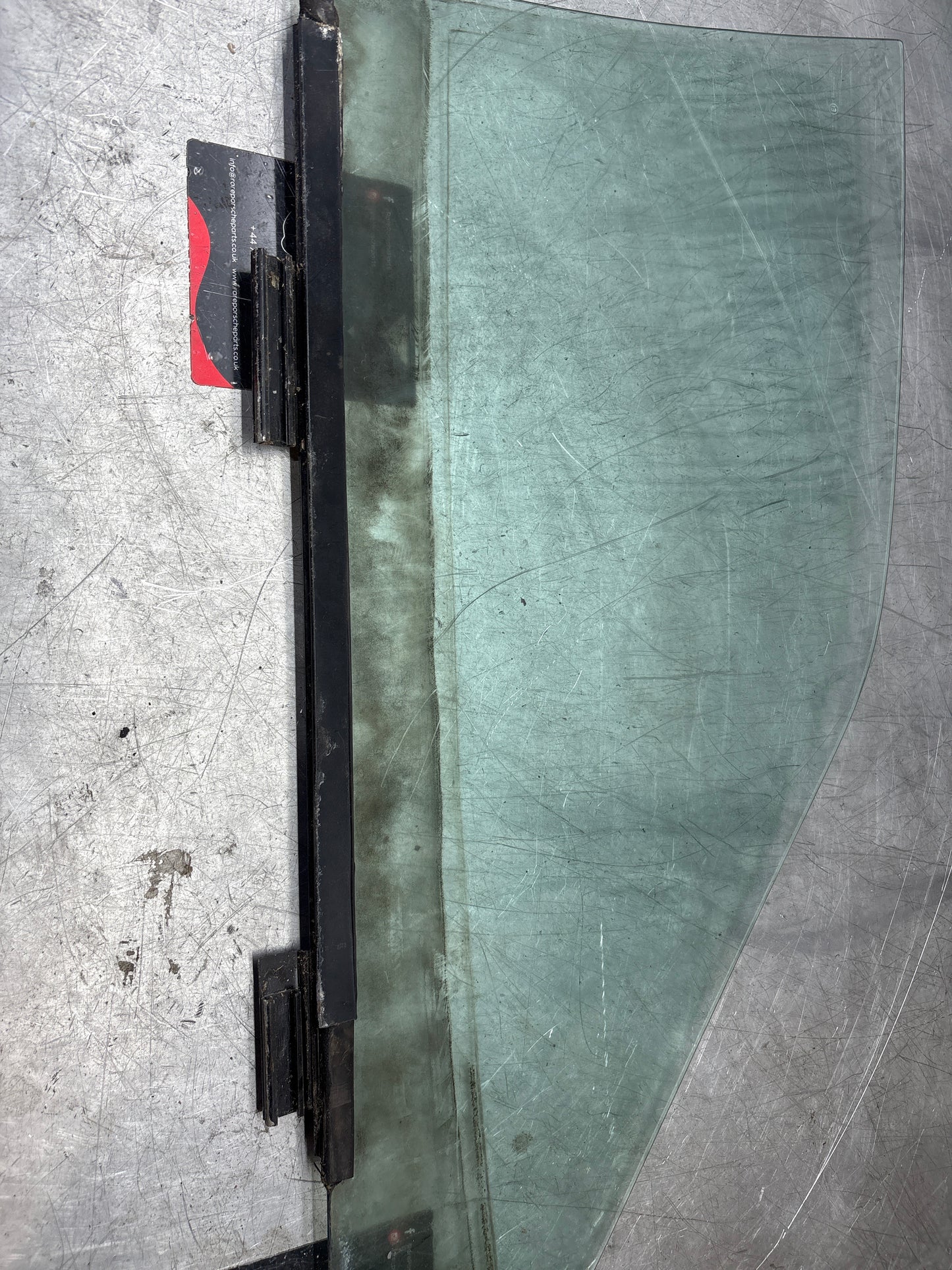 Porsche 944 Left side door glass, tinted green used 94454202301