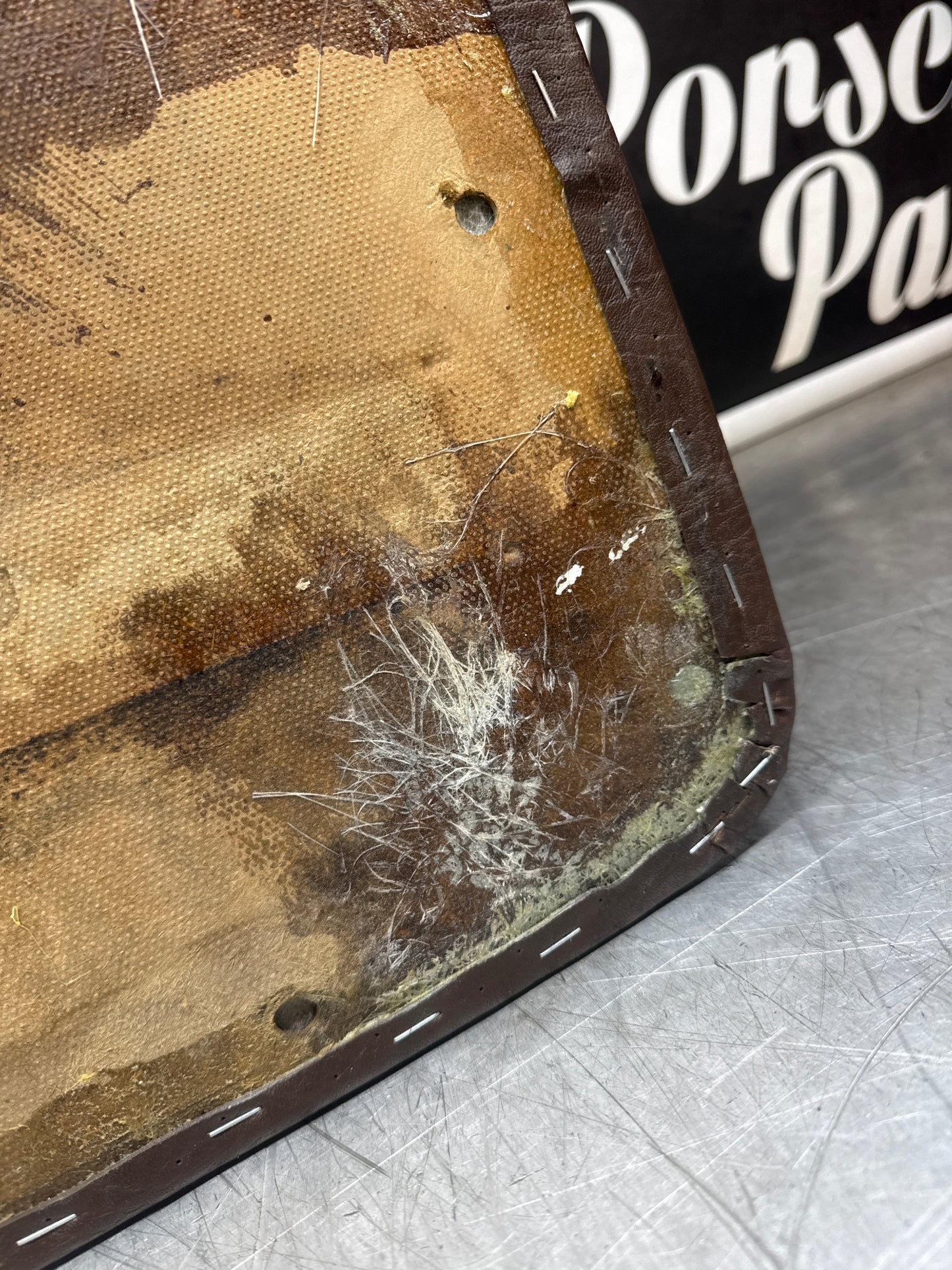 Porsche 924 / Early 944 Brown Script Door card. Left Hand Drive. Used. 478867011. Fibreglass repaired.