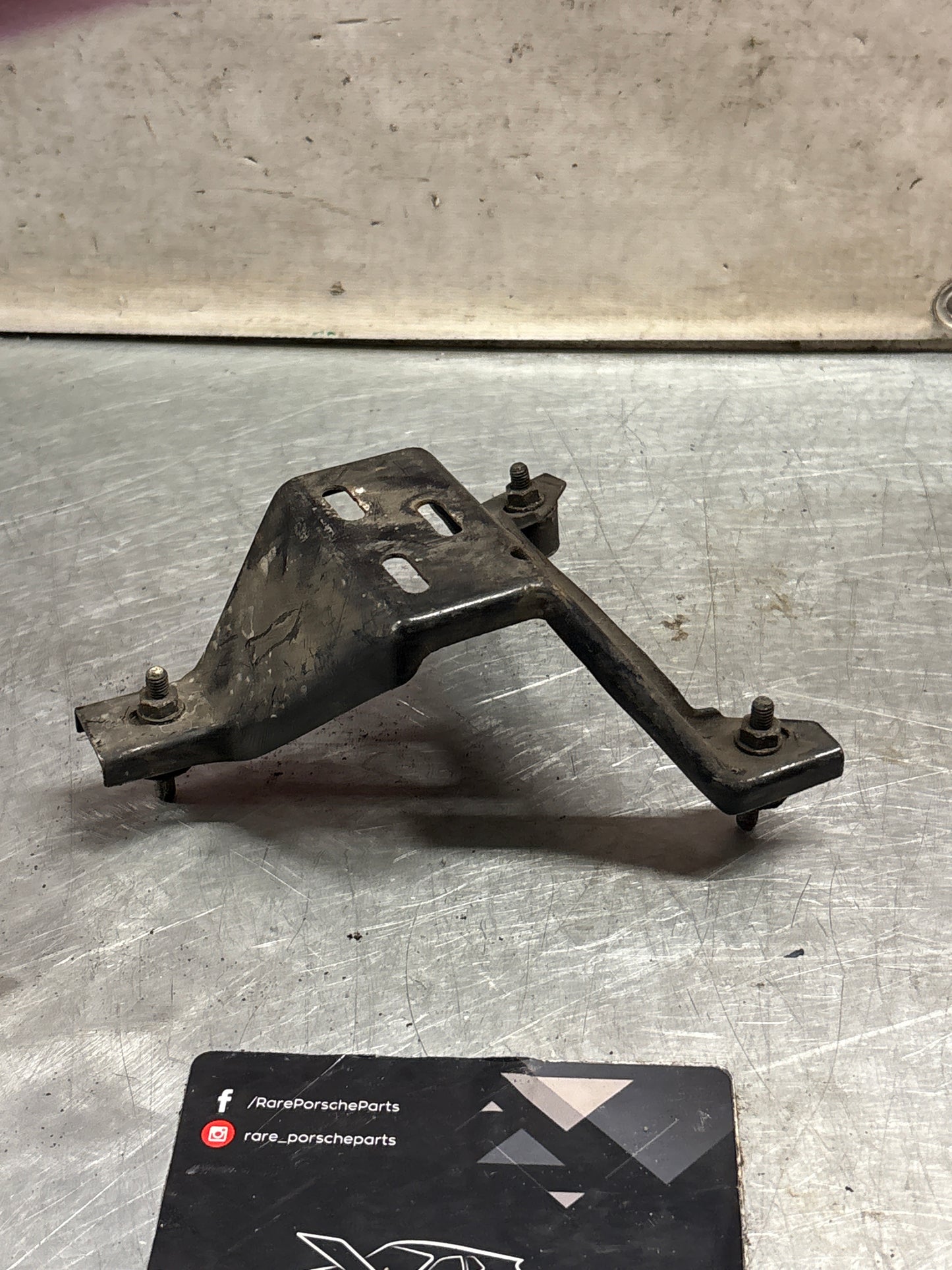 Porsche 924 Turbo air filter housing support bracket 477805513, used